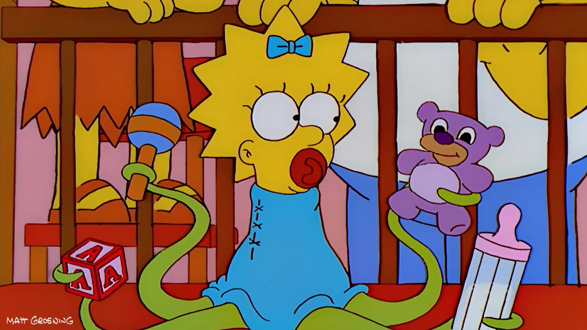 Maggie Simpson is depicted inside a crib as a green, octopus-like alien with multiple tentacles holding a rattle, a building block, a purple teddy bear, and a baby bottle.
