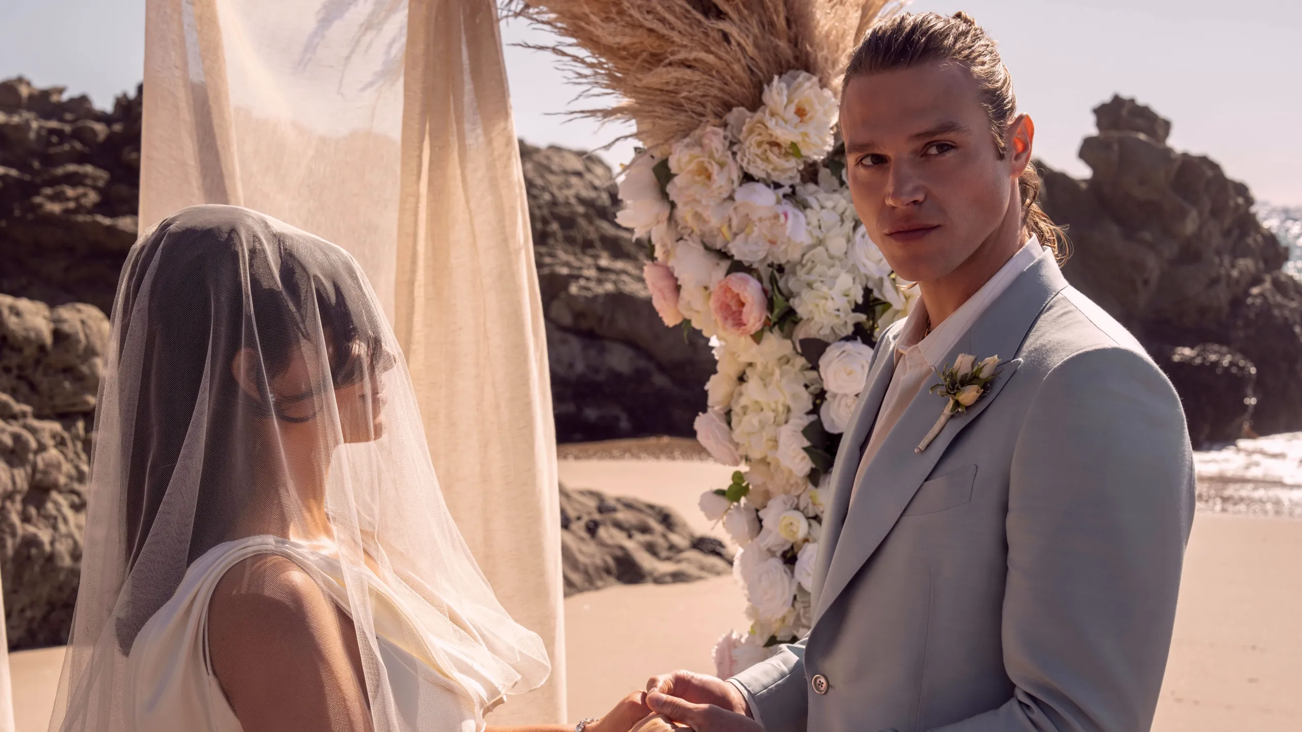 Chase Munroe (Matthew Nozska) is married to Allura Grant (Kim Kardashian) in a beach wedding.