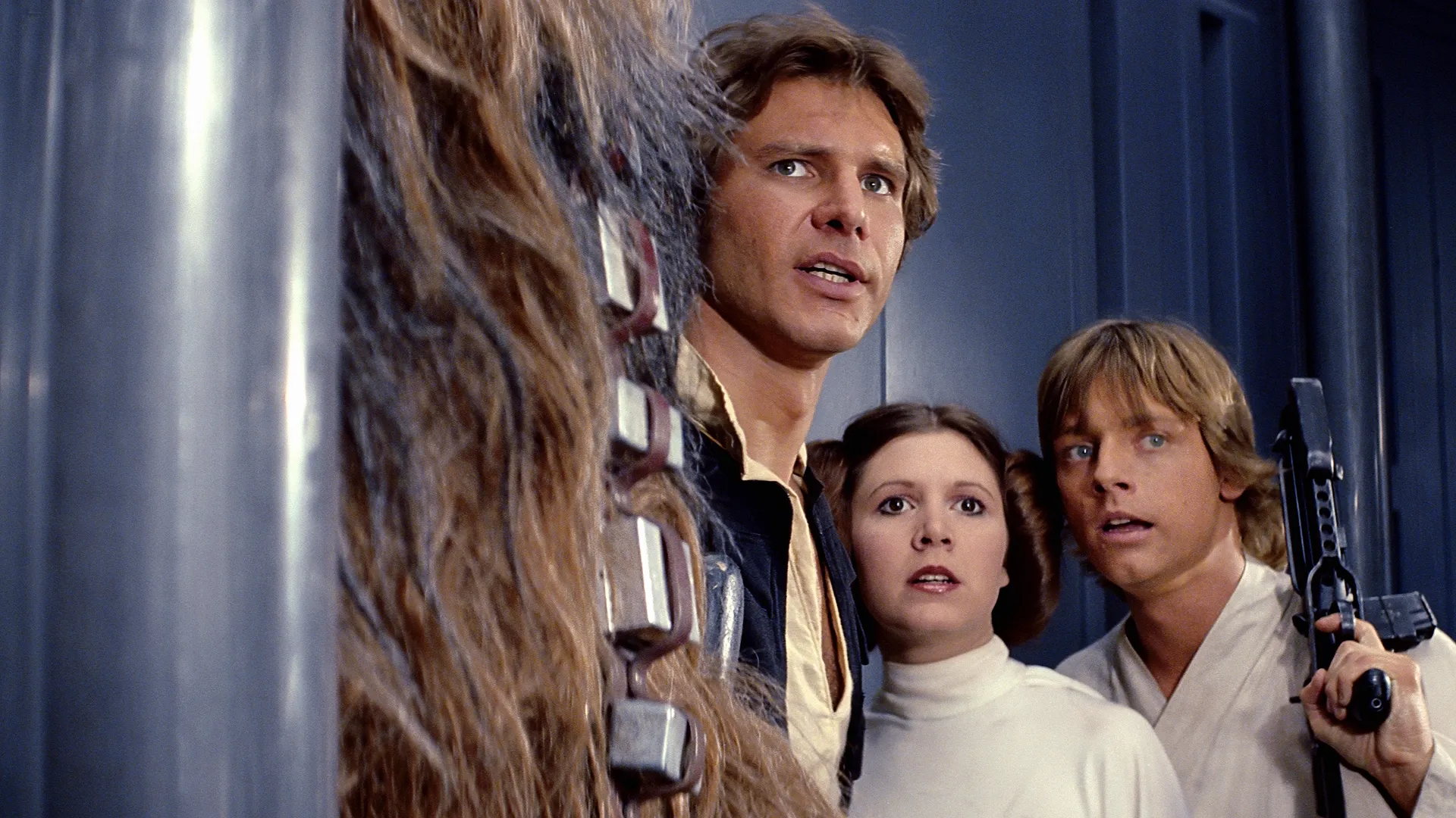 Harrison Ford as Han Solo, Carrie Fisher as Princess Leia Organa, and Mark Hamill as Luke Skywalker in the 1977 film Star Wars: Episode IV - A New Hope