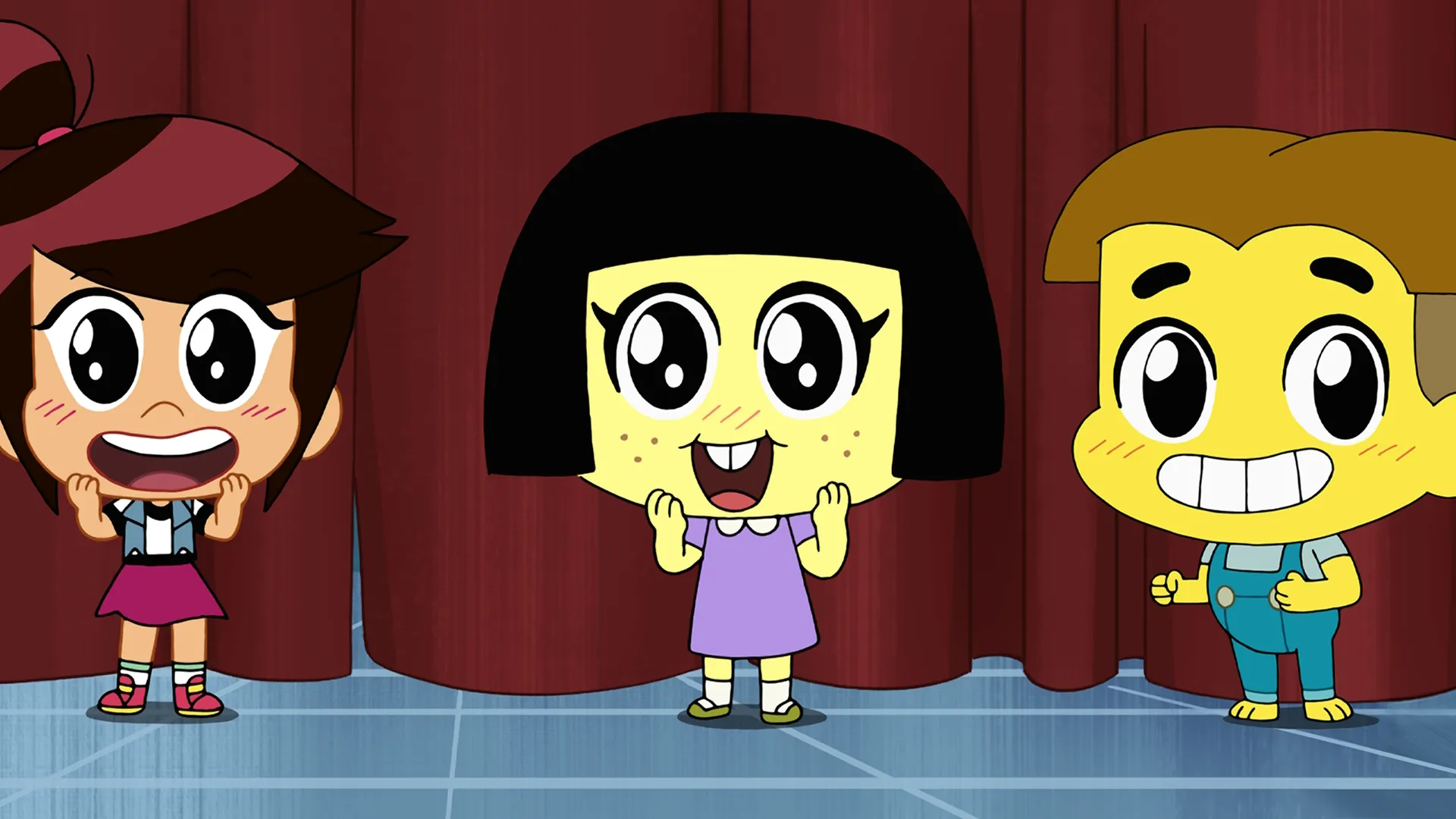 A colorful scene from the Disney animated short series Chibiverse, featuring chibi versions of Libby Stein-Torres, Tilly Green, and Cricket Green standing on a stage in front of a closed red curtain with excited expressions.