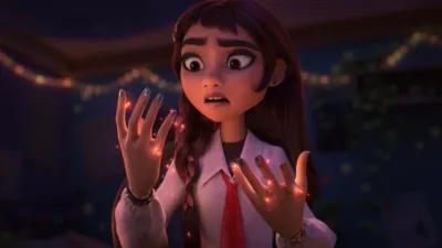 Billie, an animated teen, looks down at her hands as they start to sparkle with magic