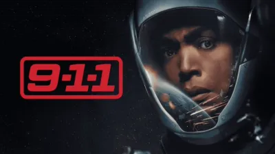 A promotional poster for the TV show "9-1-1" featuring a close-up of actress Angela Bassett wearing a futuristic space helmet, with Earth and debris reflecting in her visor against a starry background.
