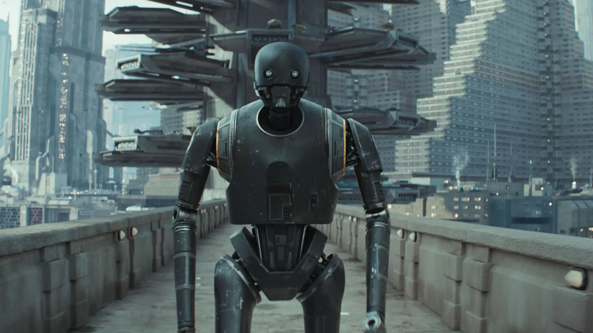 K-2SO walks across a bridge on Corucant.