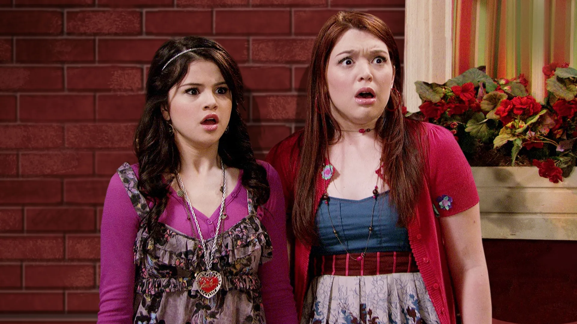 This image features Selena Gomez and Jennifer Stone from the popular Disney Channel television series Wizards of Waverly Place.