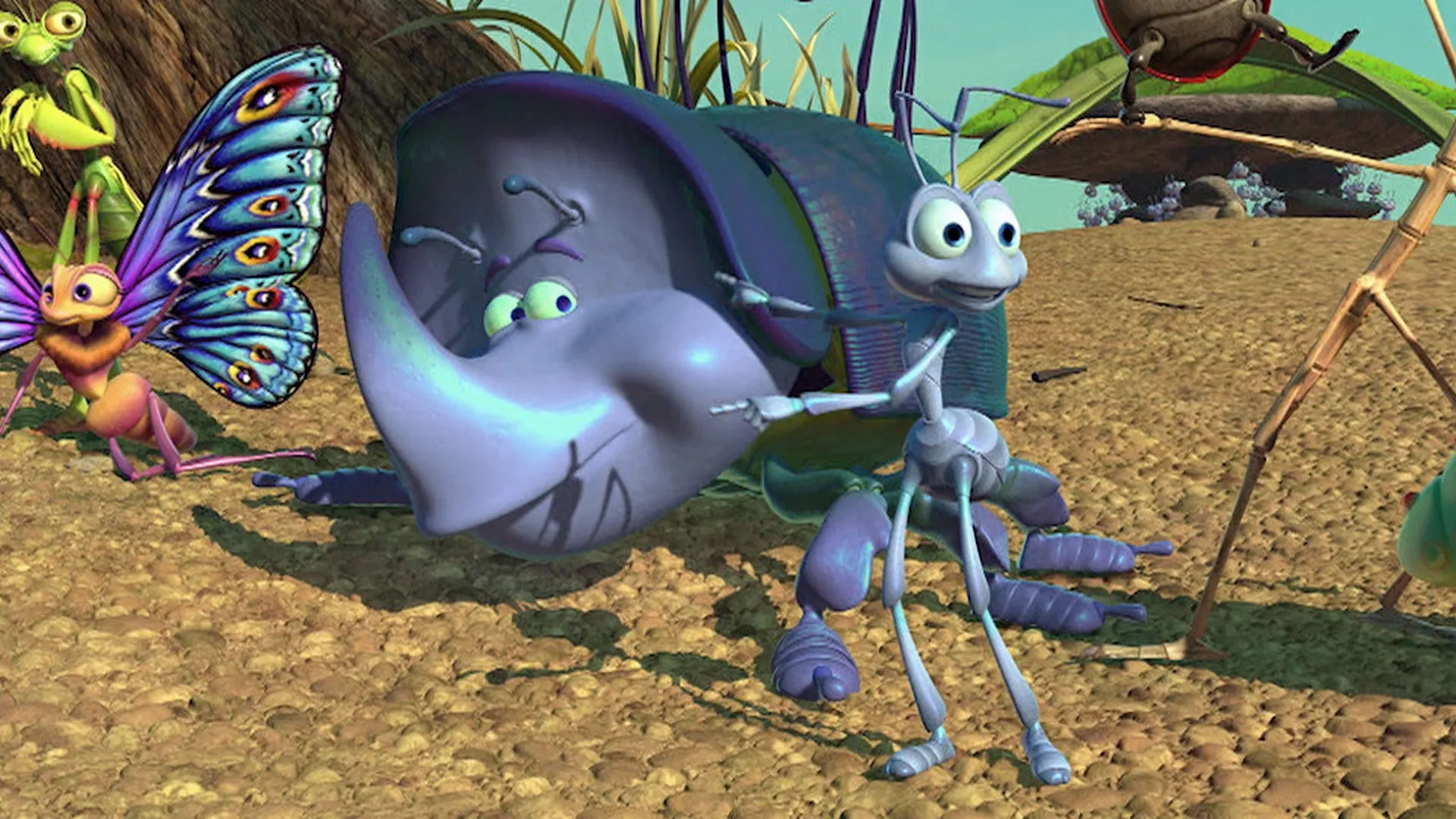 A light blue ant stands next to a large purple rhinoceros beetle in an outdoor dirt landscape, while a colorful butterfly and a praying mantis watch from the left side in a still from the animated movie A Bug's Life.