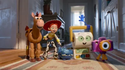 Jessie and Bullseye stand in a hallway with other toys in a scene from Disney and Pixar's Toy Story 5.