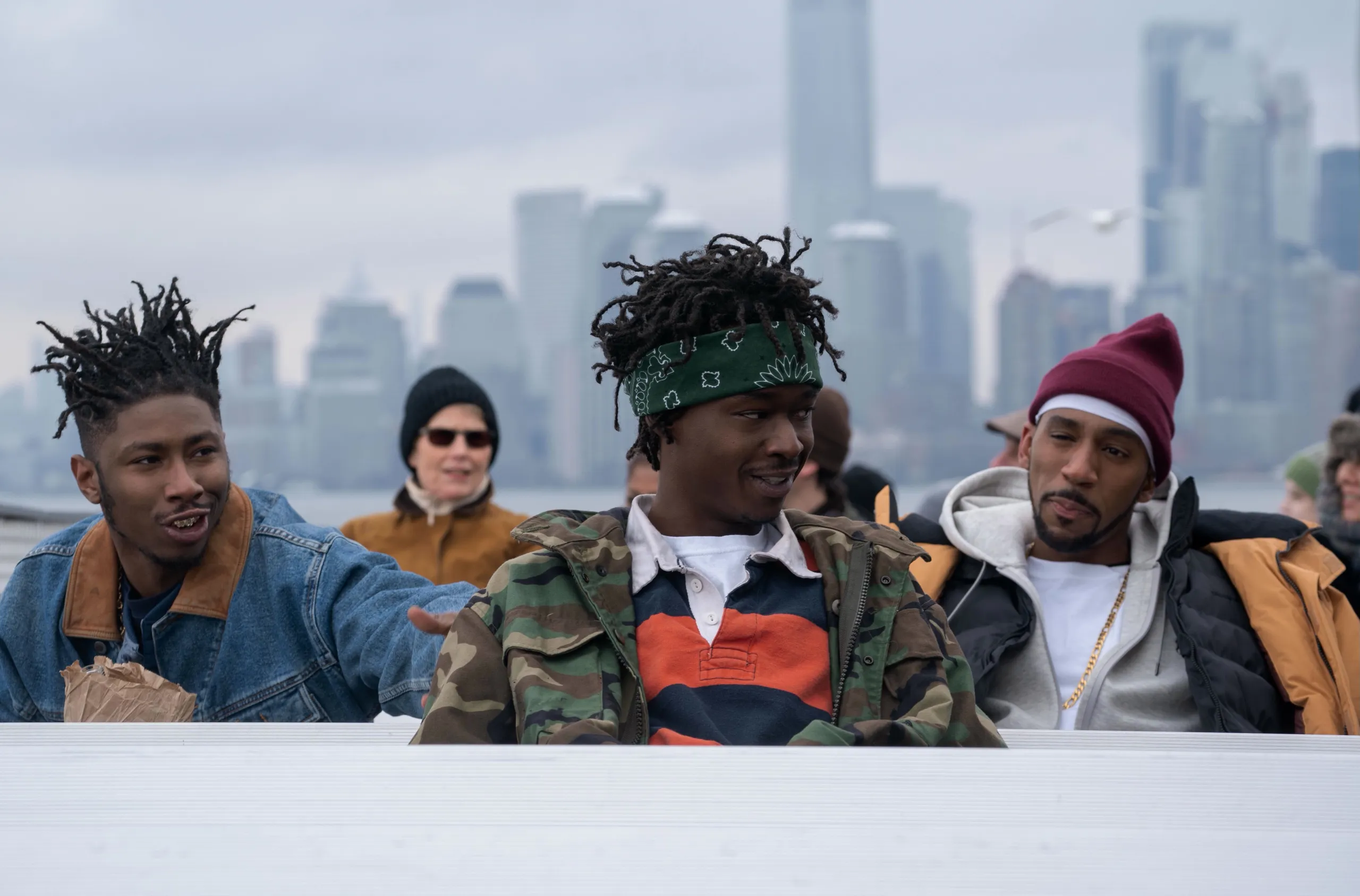 Russell Tyrone Jones, aka Ol' Dirty Bastard, played by TJ Atoms, Bobby Diggs, aka RZA, played by Ashton Sanders, and Dennis Coles, aka Ghostface Killah played by Siddiq Saunderson sit on a ferry, with 