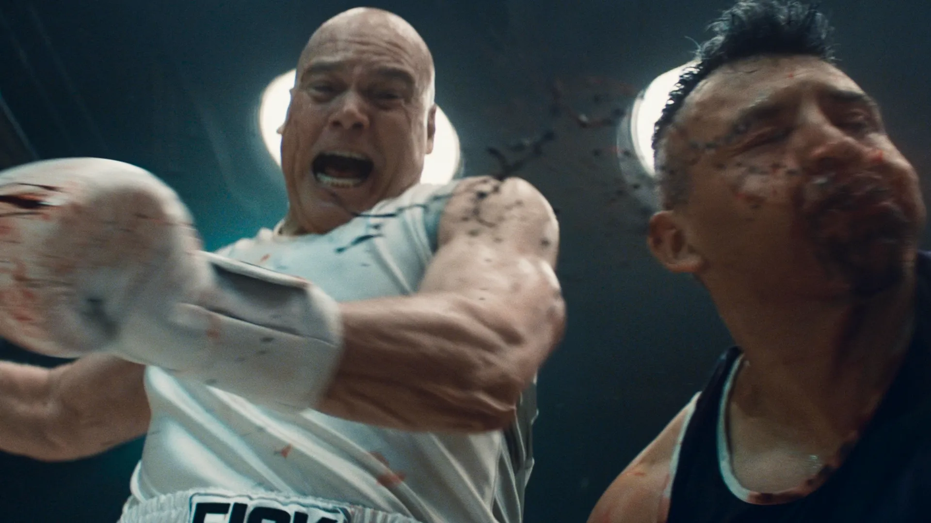 Wilson Fisk (Vincent D'Onofrio) punching down in boxing gear