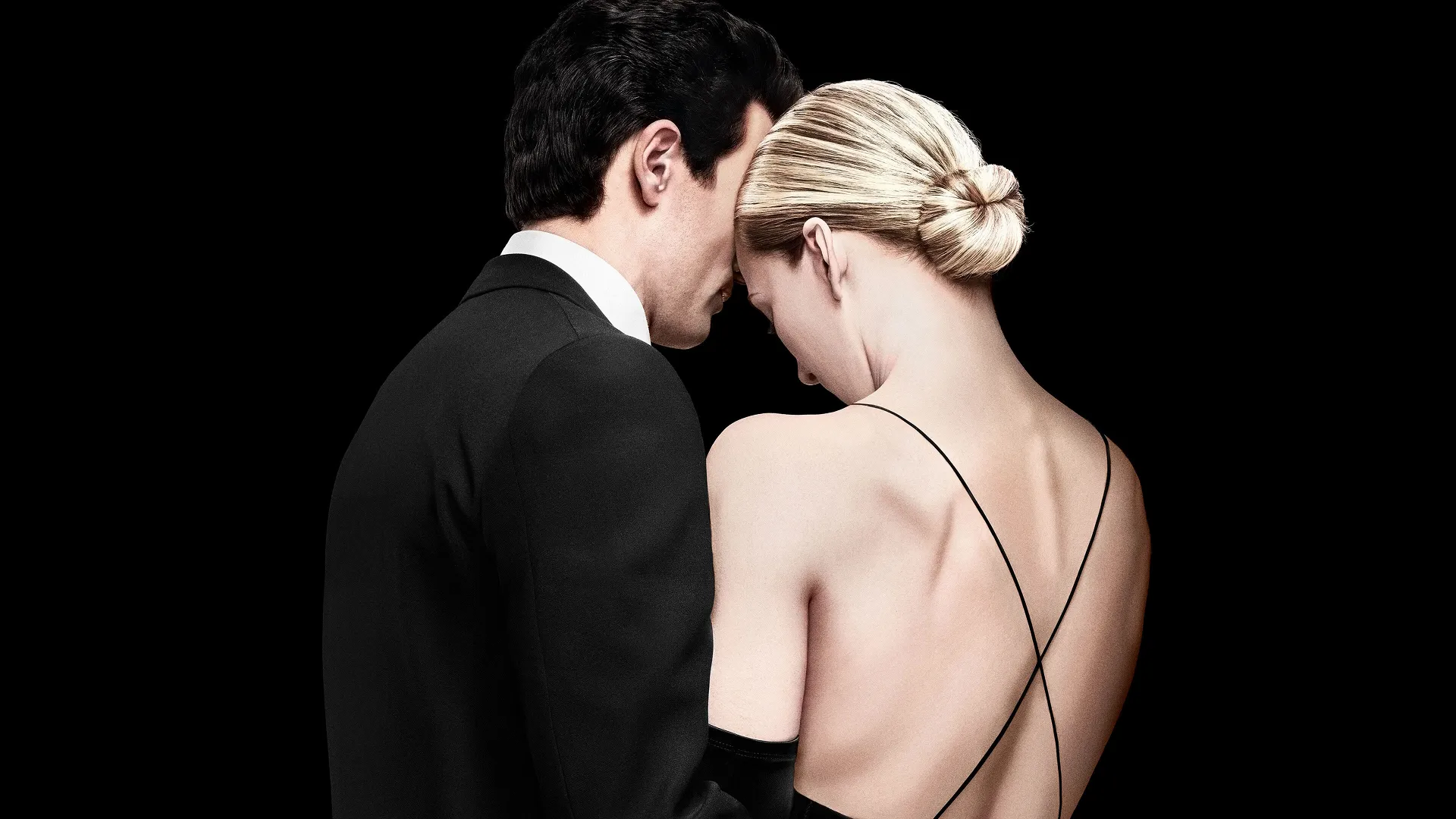 Promo art for FX's Love Story: John F. Kennedy Jr. & Carolyn Bessette showcasing them both together facing away from the screen.