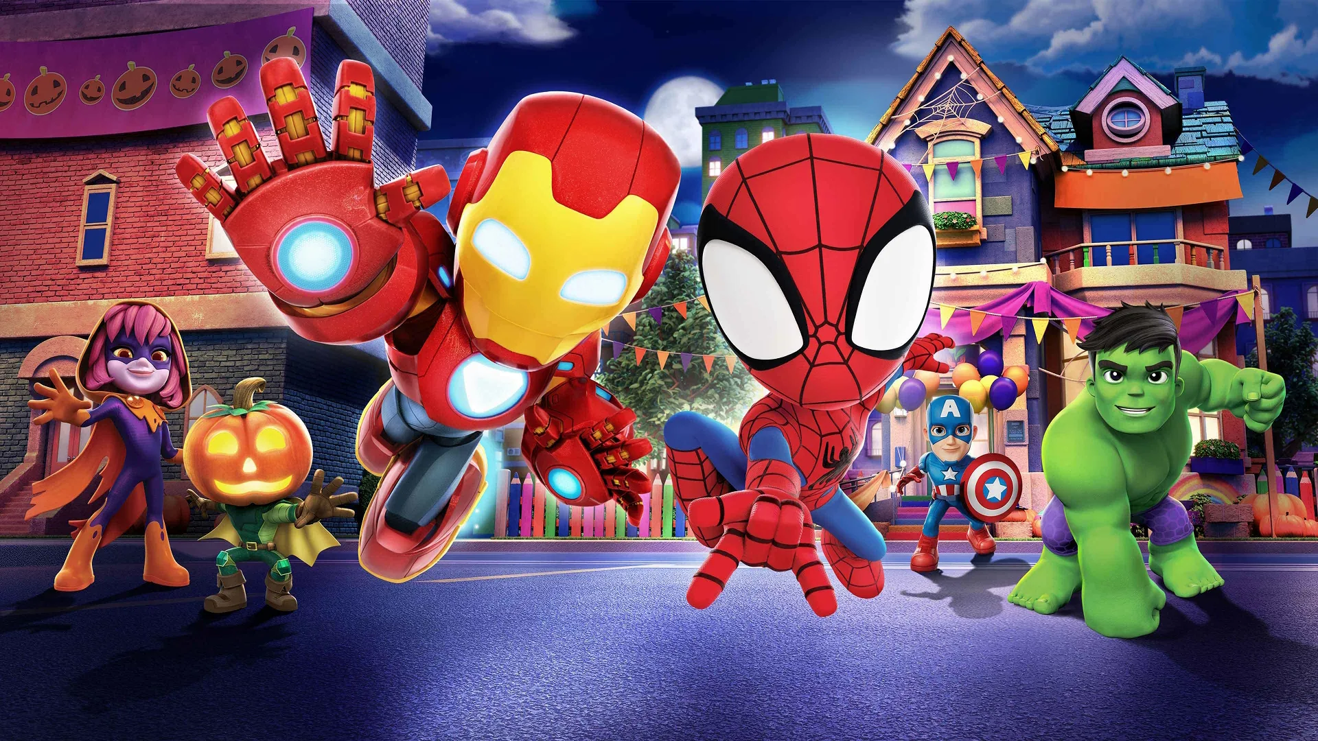 Iron Man, Spidey, and Hulk jump forward in dynamic action poses on a city street decorated for Halloween, with a small pumpkin-headed character and a witch-costumed girl visible in the colorful background.