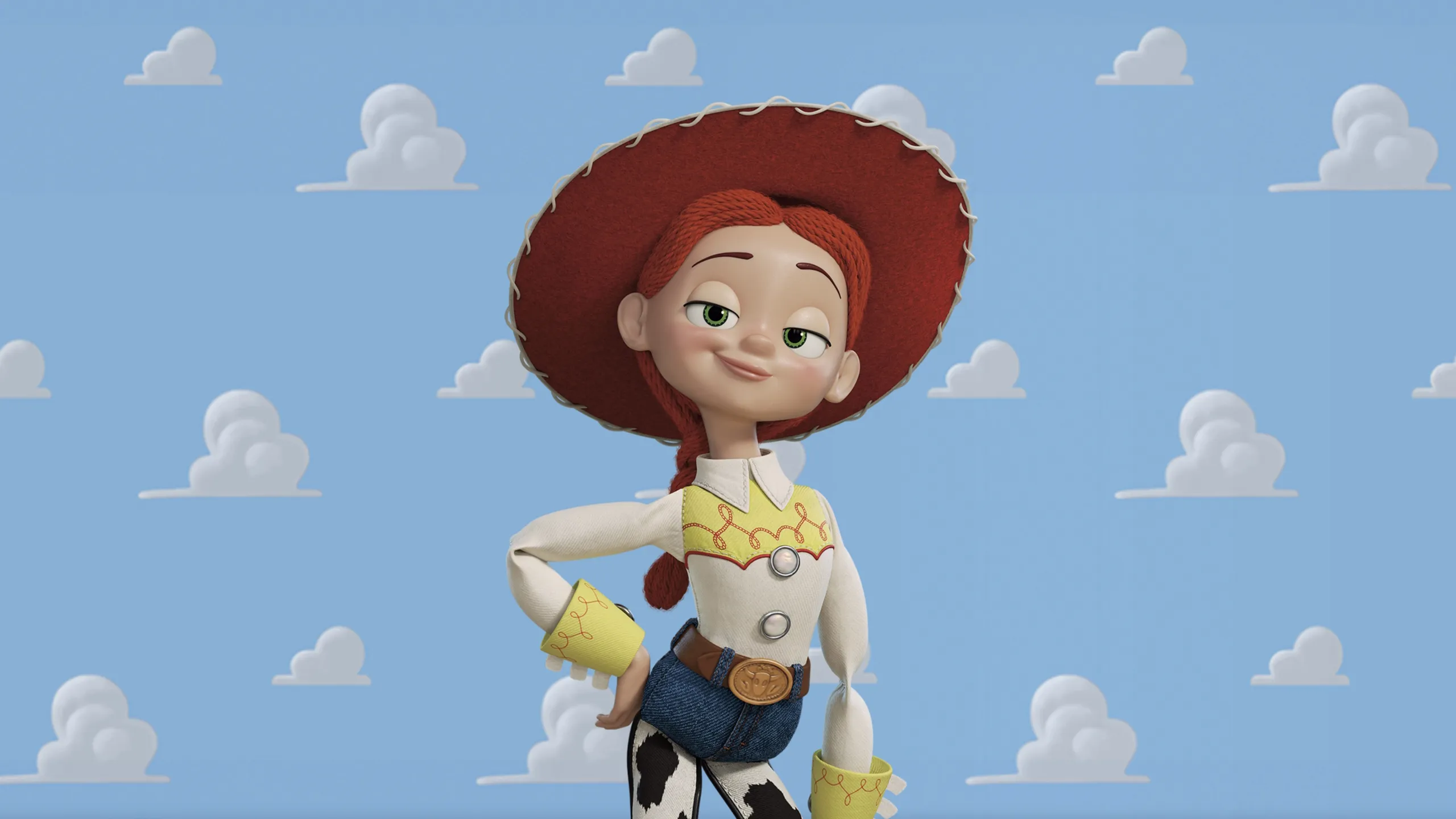 Jessie in her white and yellow western shirt, blue jeans with cow-print chaps, and a red cowgirl hat