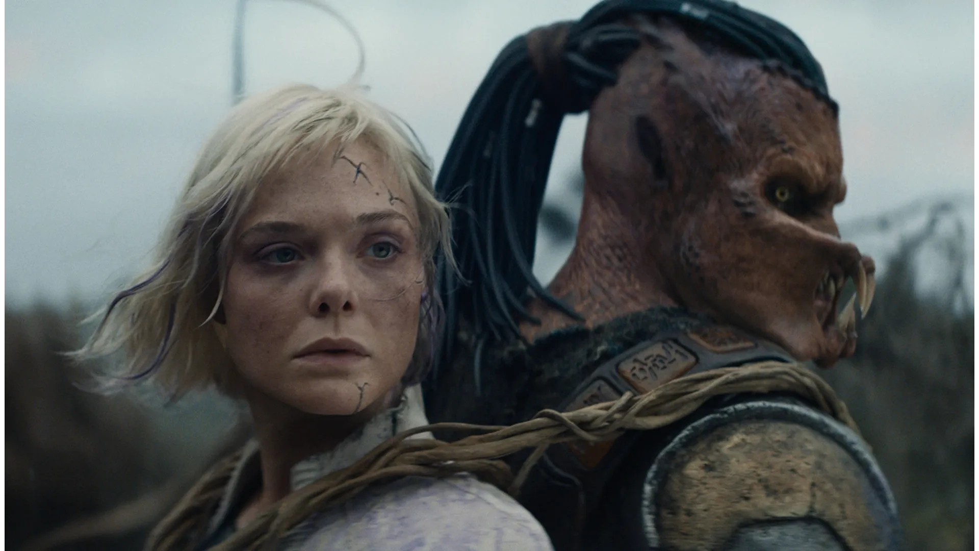 Elle Fanning as Thia in Predator Badlands alongside the Yautja, Dek