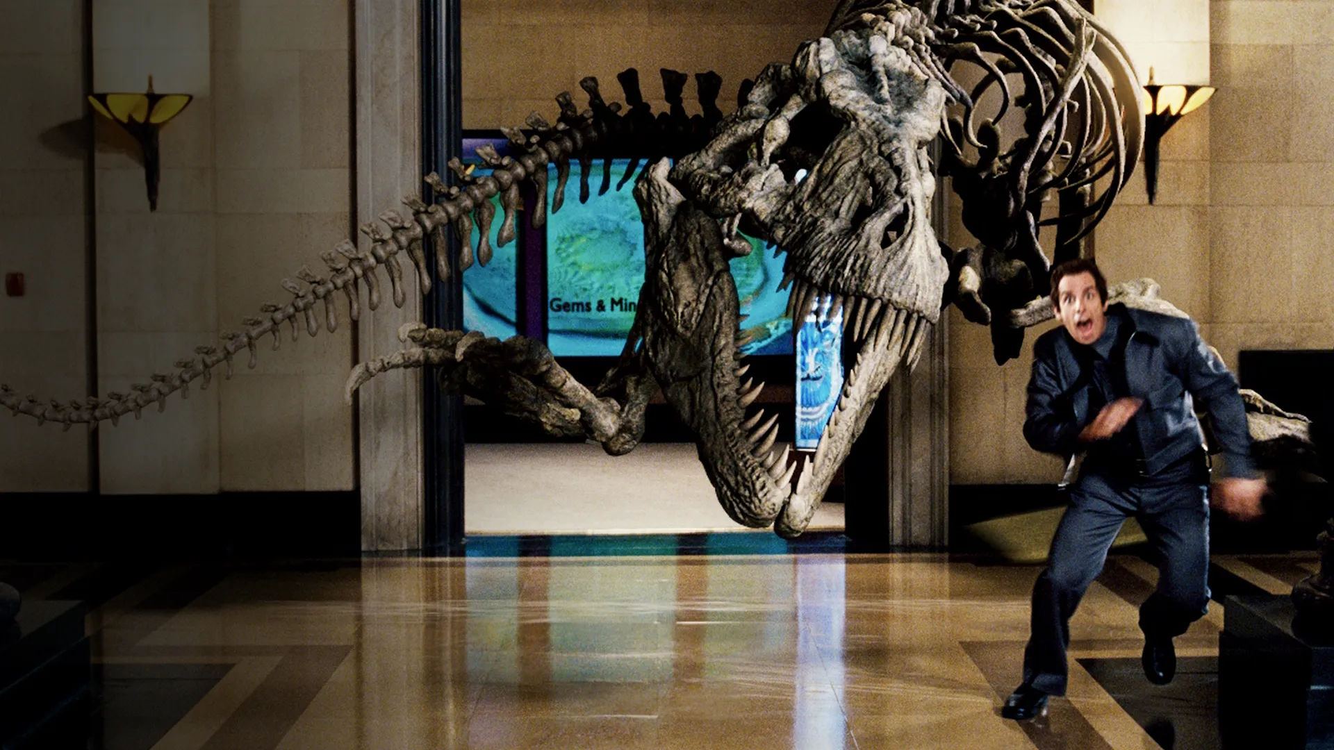 Ben Stiller as Larry Daley running from a Tyrannosaurus rex skeleton in Night at the Museum