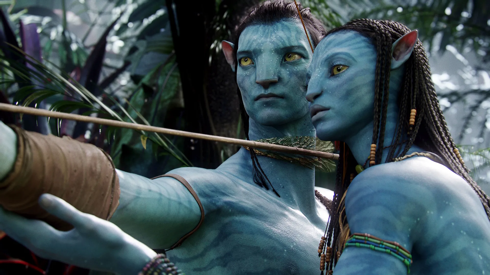 Sully (Sam Worthington) is trained with a bow by Neytiri (Zoe Saldana).