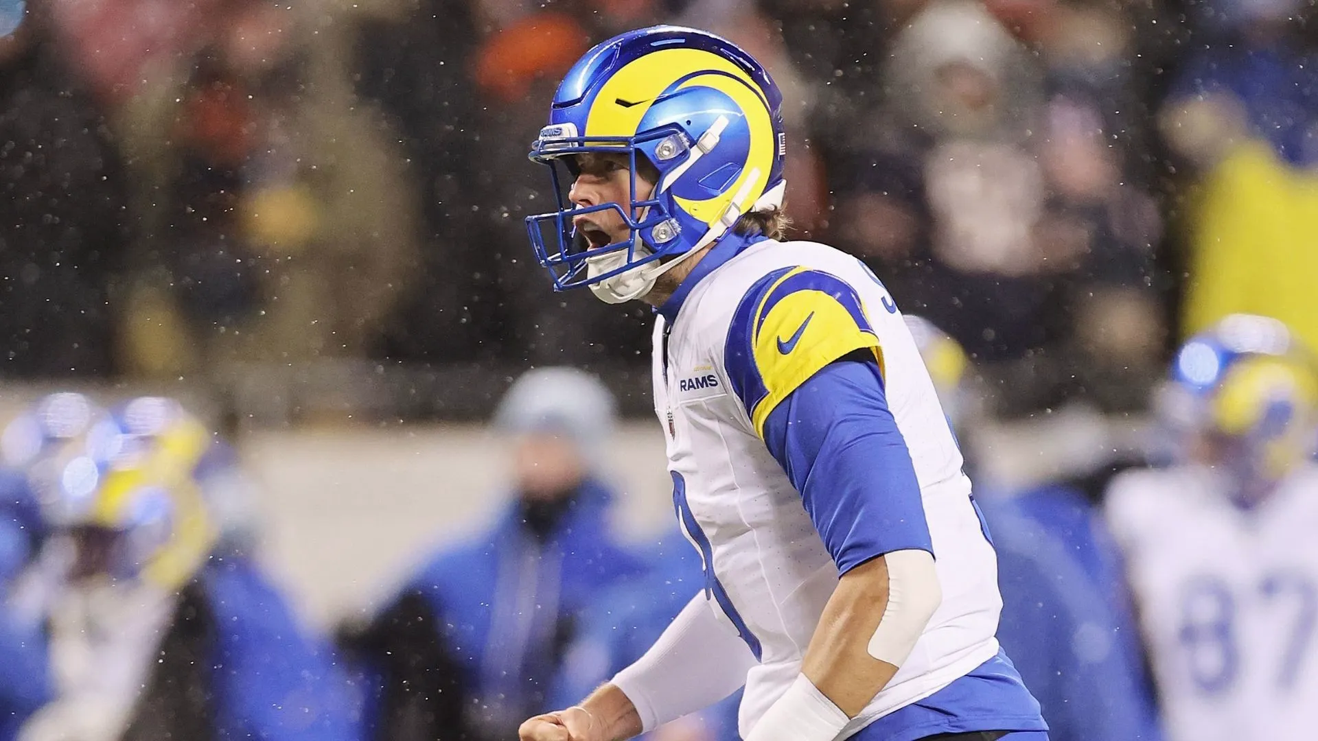 Matthew Stafford #9 of the Los Angeles Rams reacts after a touchdown against the Chicago Bears during the first quarter in the NFC Divisional Playoffs at Soldier Field on January 18, 2026 in Chicago, Illinois. 