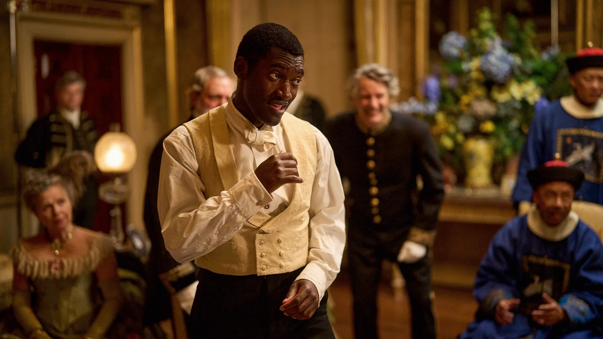 Hezekiah Moscow (Malachi Kirby) raises his fist.
