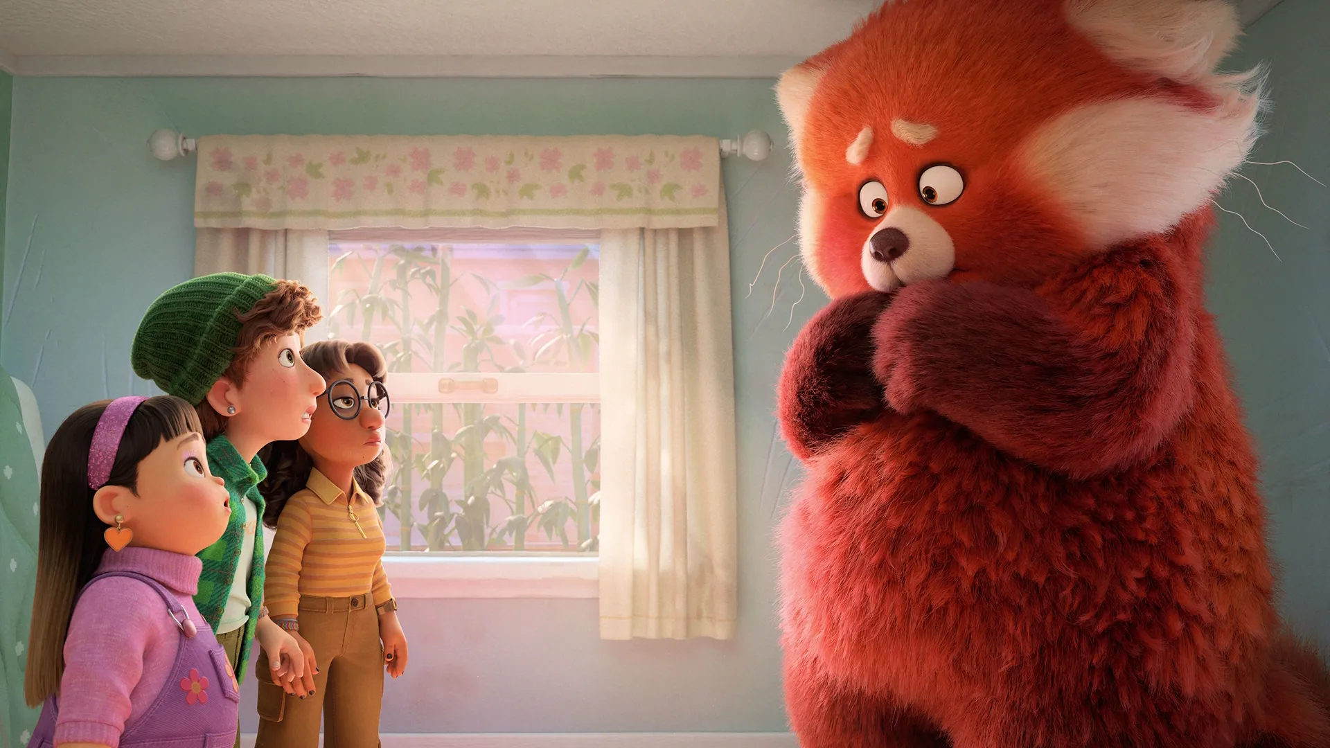 Mei stands in a bedroom in her red panda form, as her friends Abby, Miriam, and Priya look on in surprise