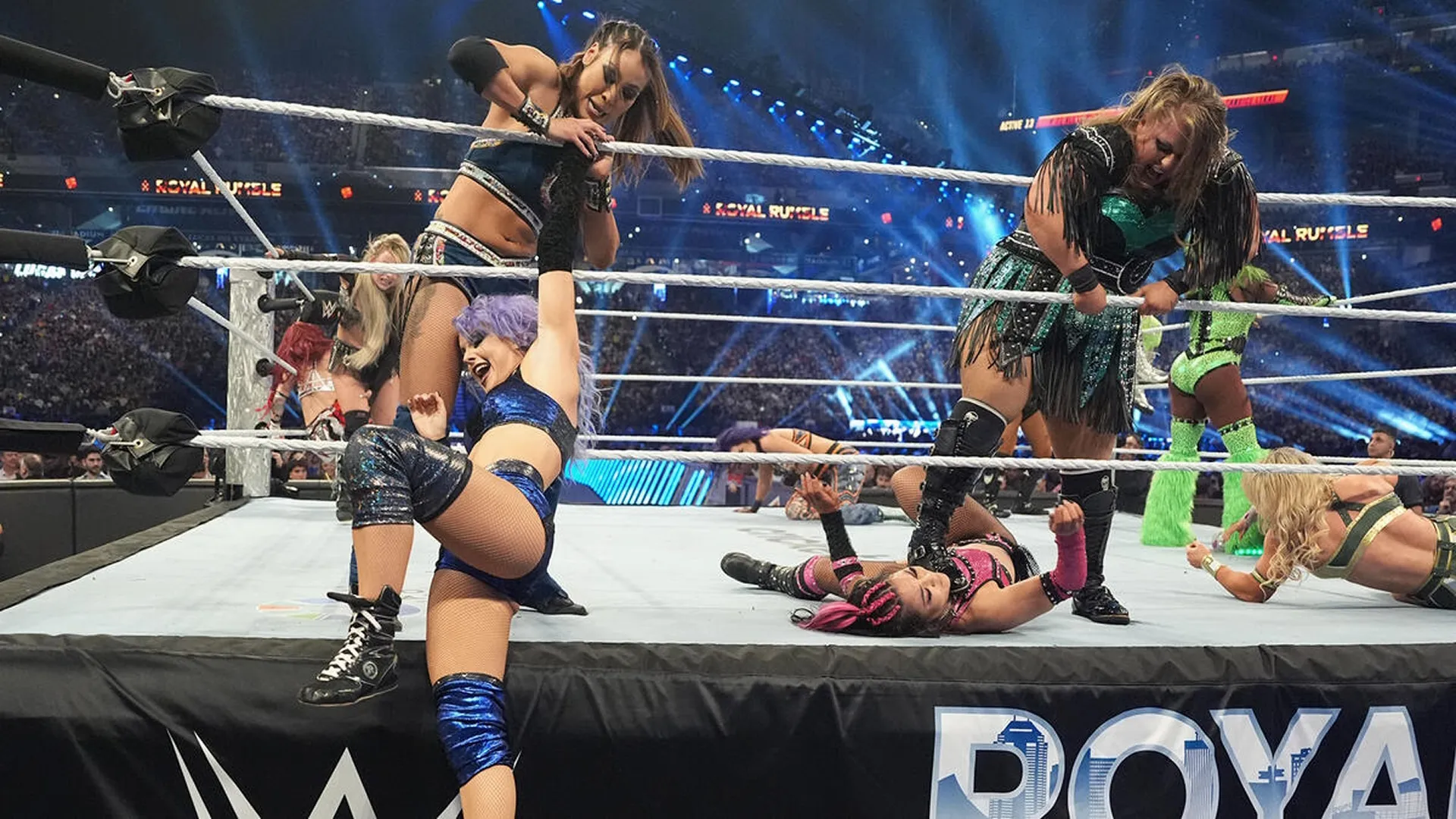 Wrestlers Michin, Candice LeRae, Piper Niven, and Roxxane Perez wrestling in the ring at WWE Royal Rumble