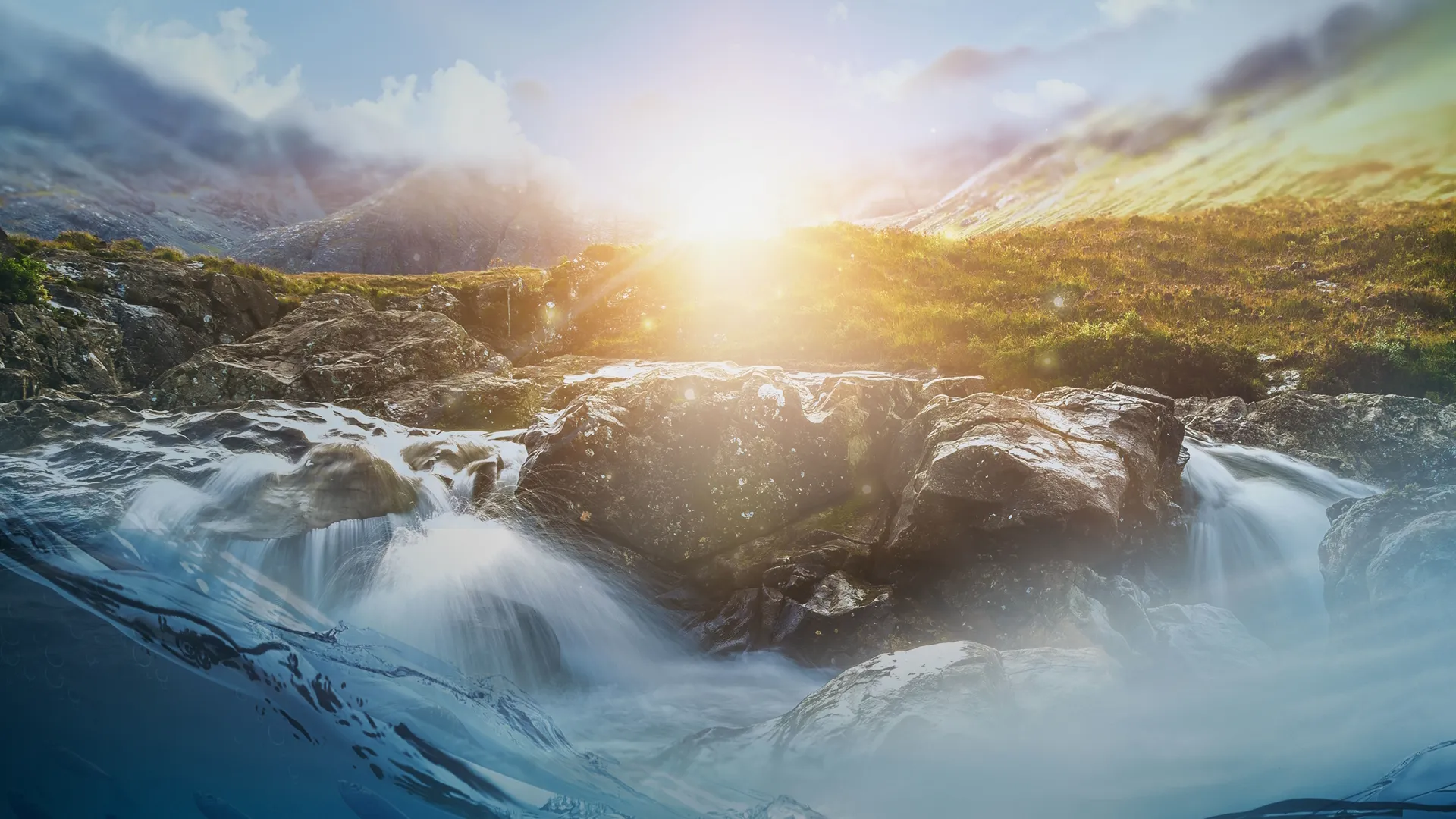 Water rushing over rocks as the sunrises over the landscape.