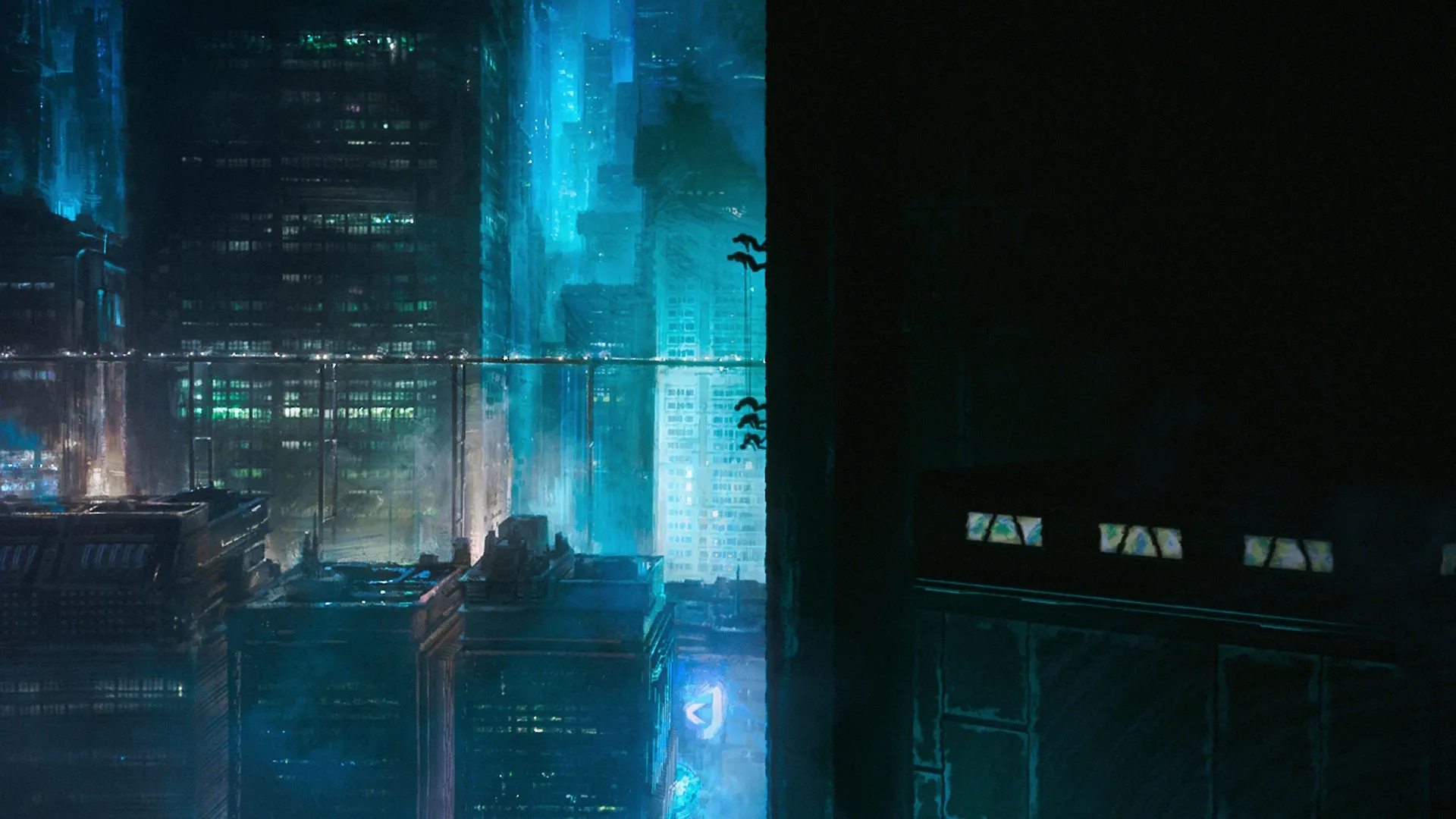 Wide shot of the planet Janix shows a cityscape at night with a blue-ish hue from the lights.