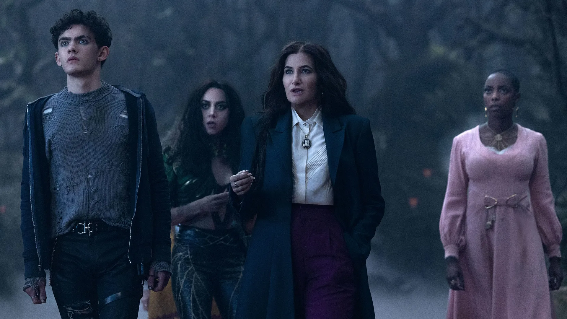 Agatha Harkness (Kathryn Hahn) on the Witches Road with Billy Maximoff (Joe Locke), Rio Vidal (Aubrey Plaza) and Jennifer Kale (Sasheer Zamata).
