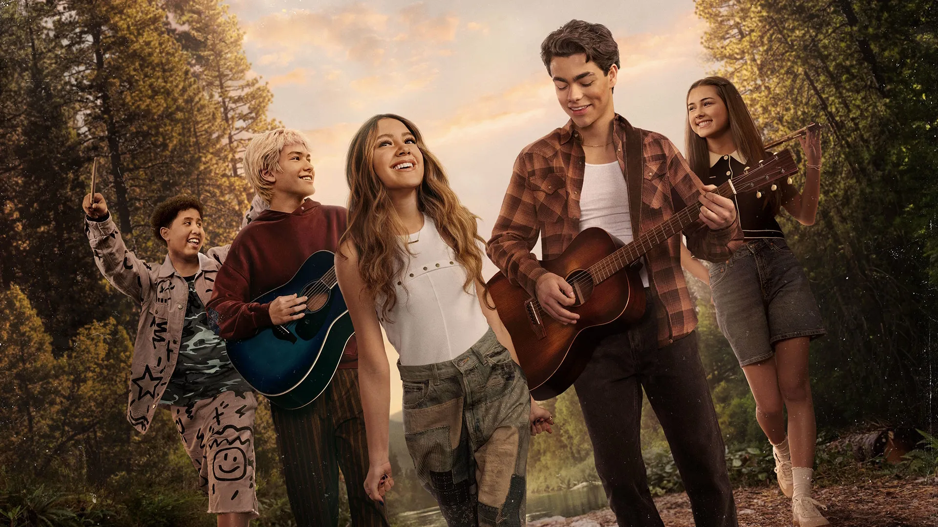 Key art for Camp Rock 3 featuring a group of teenagers walking through a forest while carrying guitars and musical instruments.