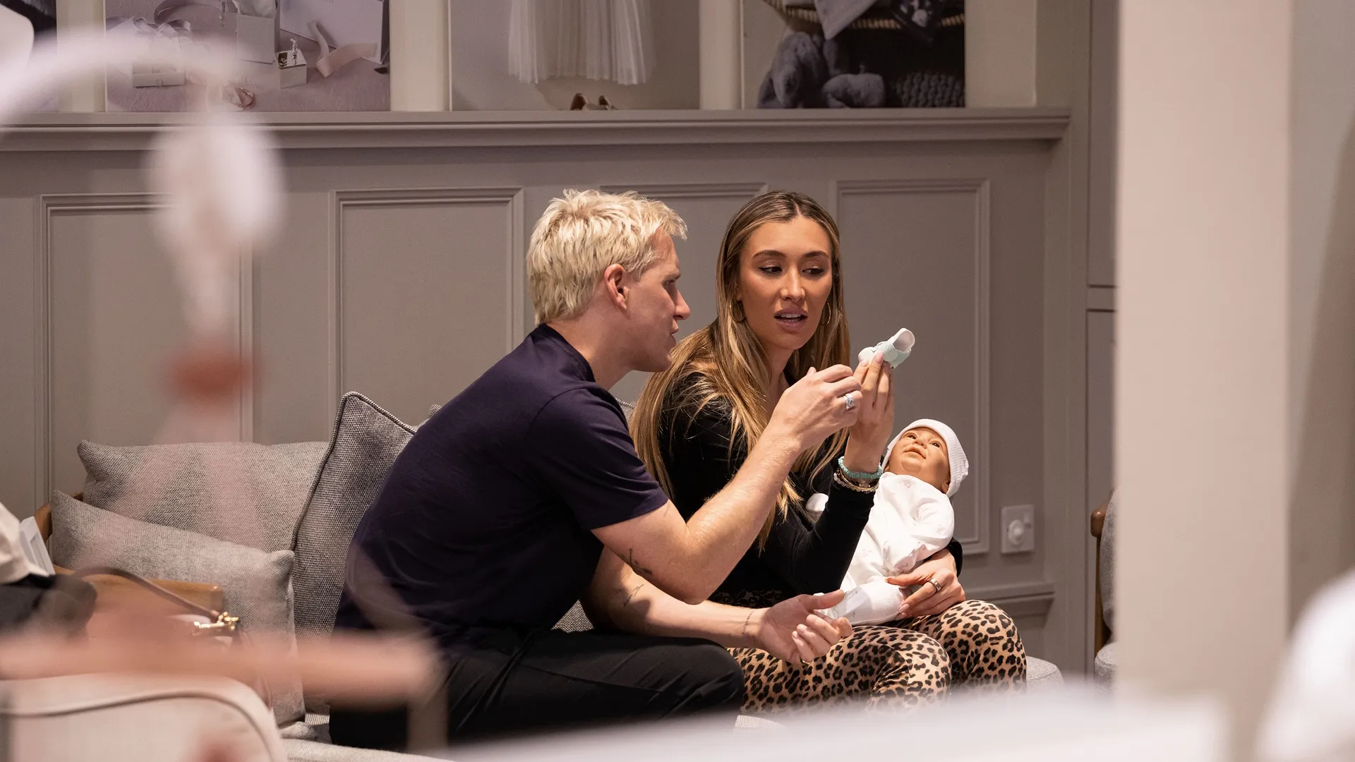 Jamie Laing and Sophie Habboo sitting on the sofa