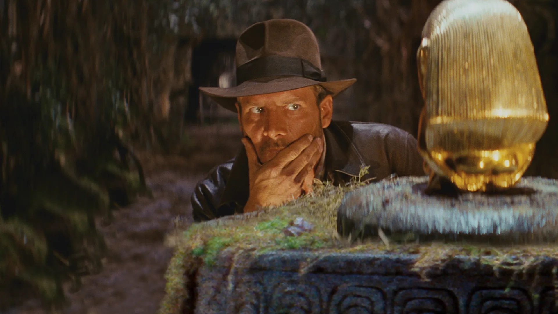Harrison Ford as Indiana Jones in a tense scene from the 1981 film Raiders of the Lost Ark.