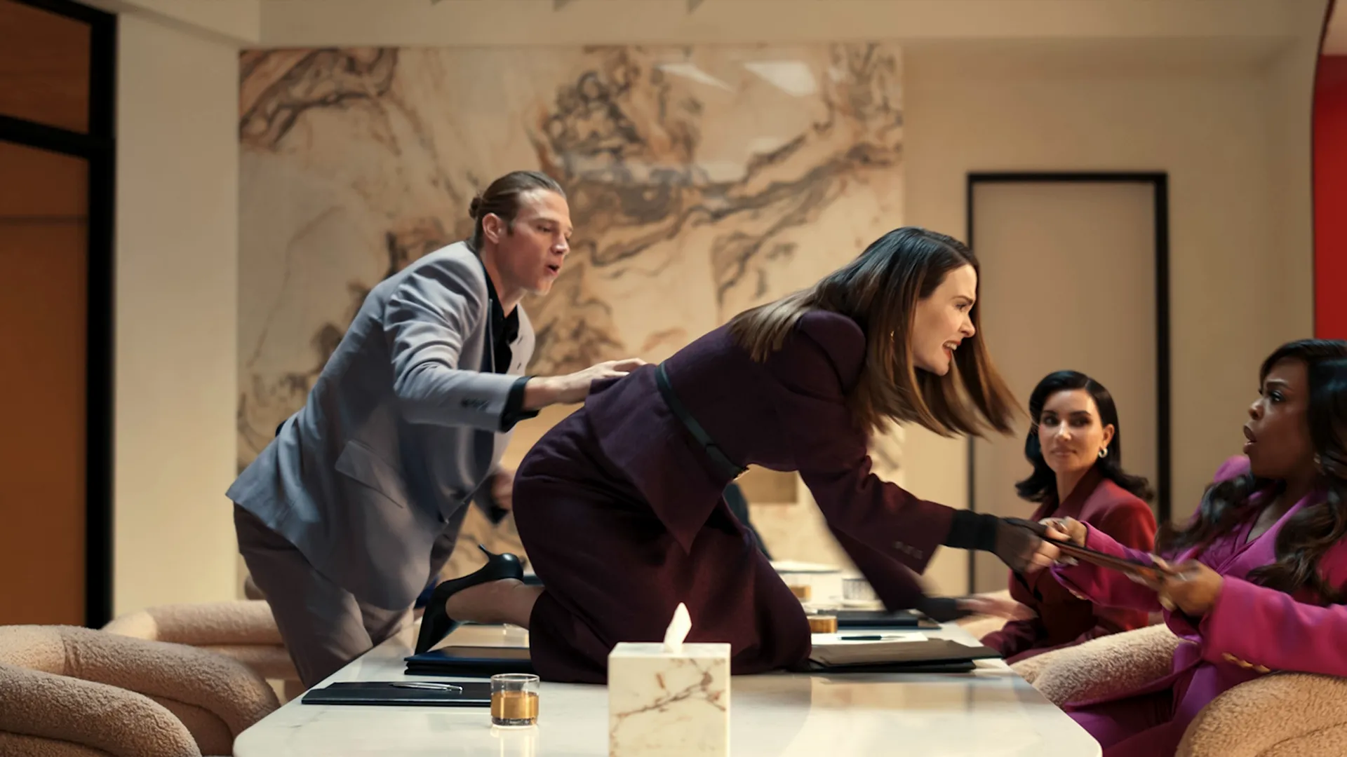 "Carr" Lane (played by Sarah Paulson) confronts another woman during a meeting.