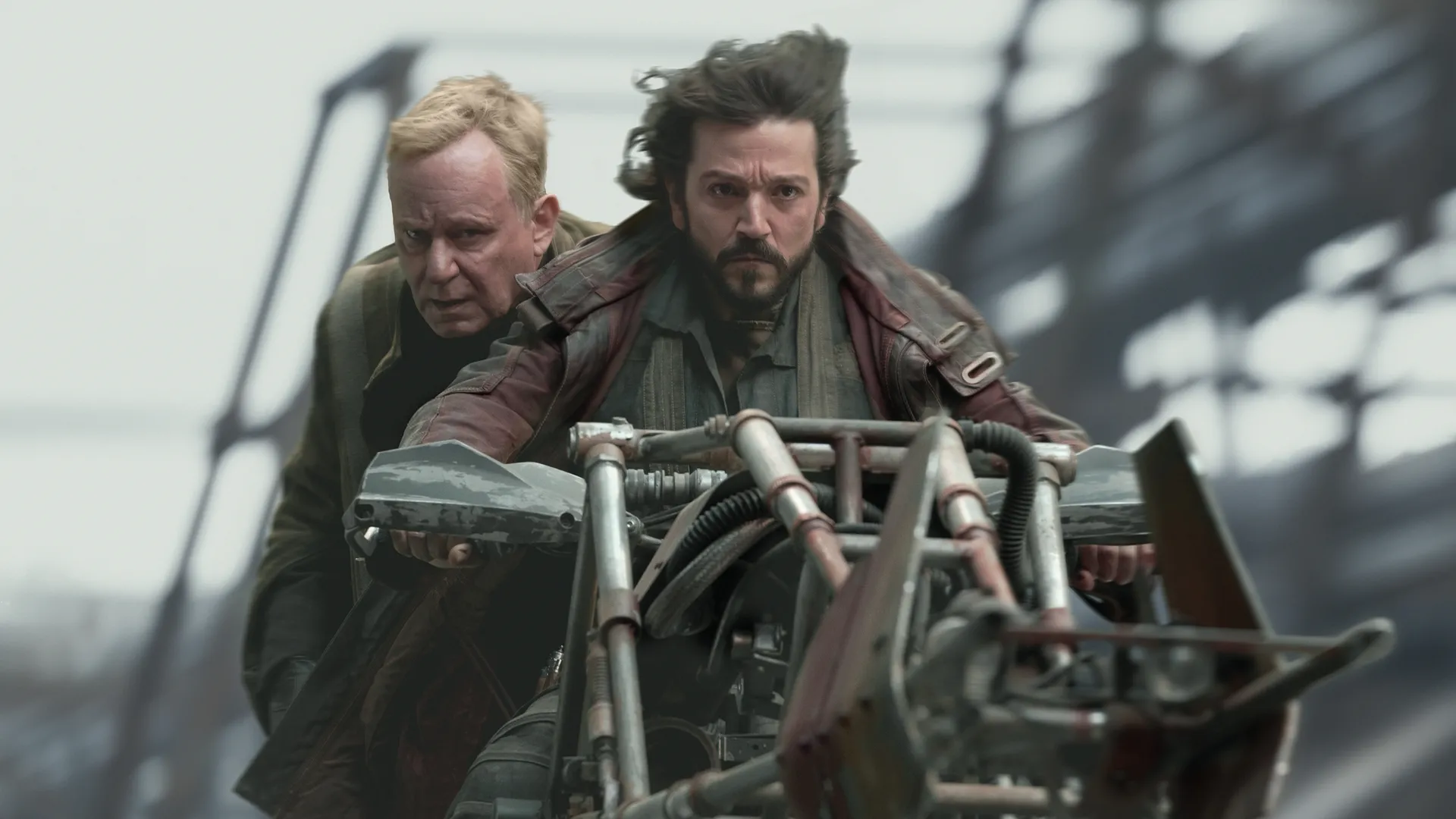 Cassian Andor (Diego Luna) and Luthen Rael (Stellan Skarsgård) ride on a hoverbike