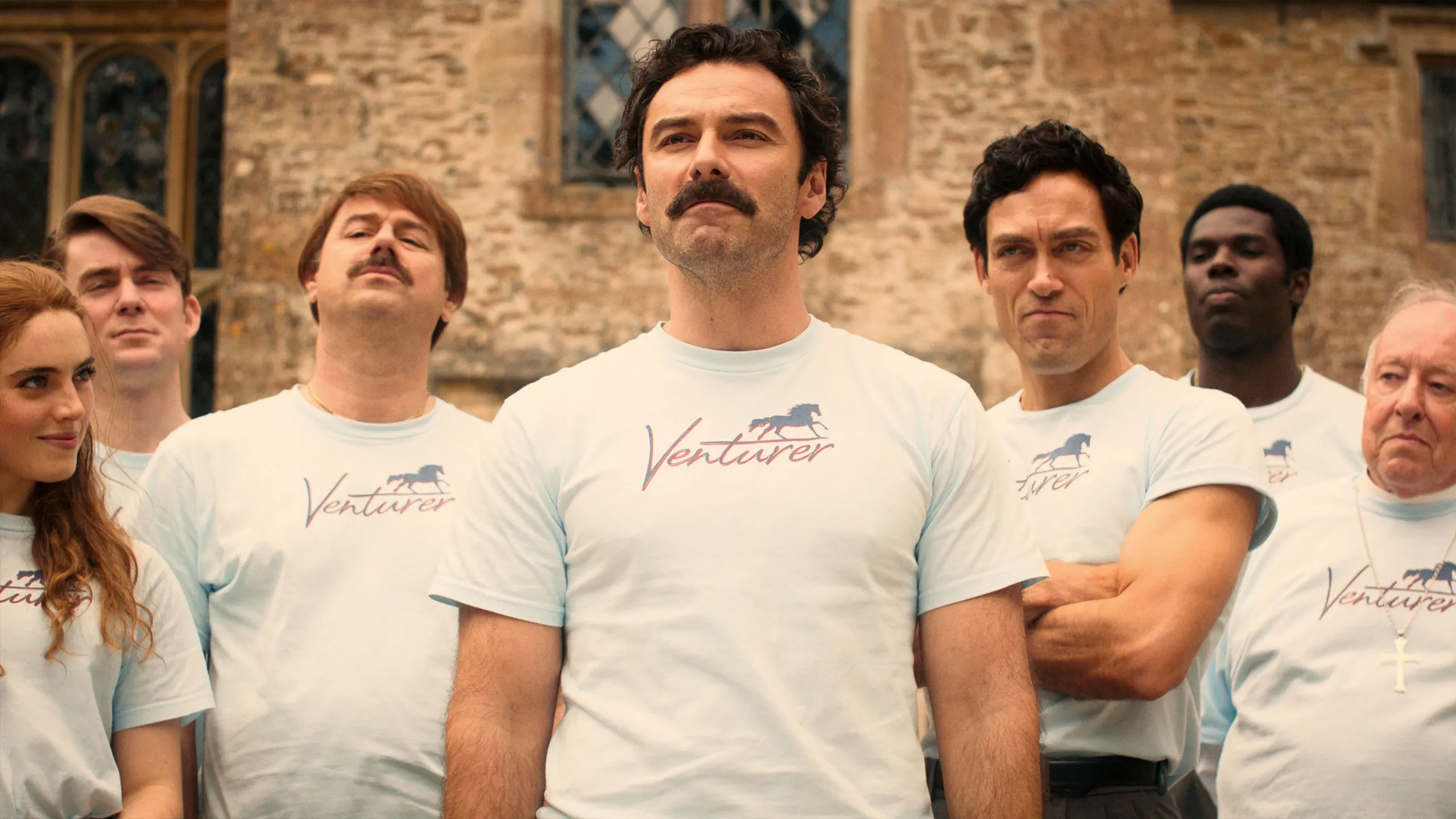 This image features the cast of Rivals, a British television drama series based on the novel by Jilly Cooper.