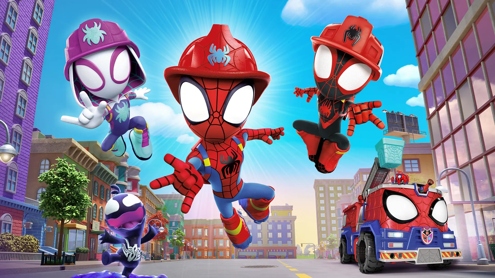 A bright, action-packed promotional image from the animated series Spidey and His Amazing Friends featuring Peter Parker, Miles Morales, and Ghost-Spider wearing red and purple firefighter helmets as they leap through the air above a city street alongside a spider-themed fire truck and a small purple Venom-like character.