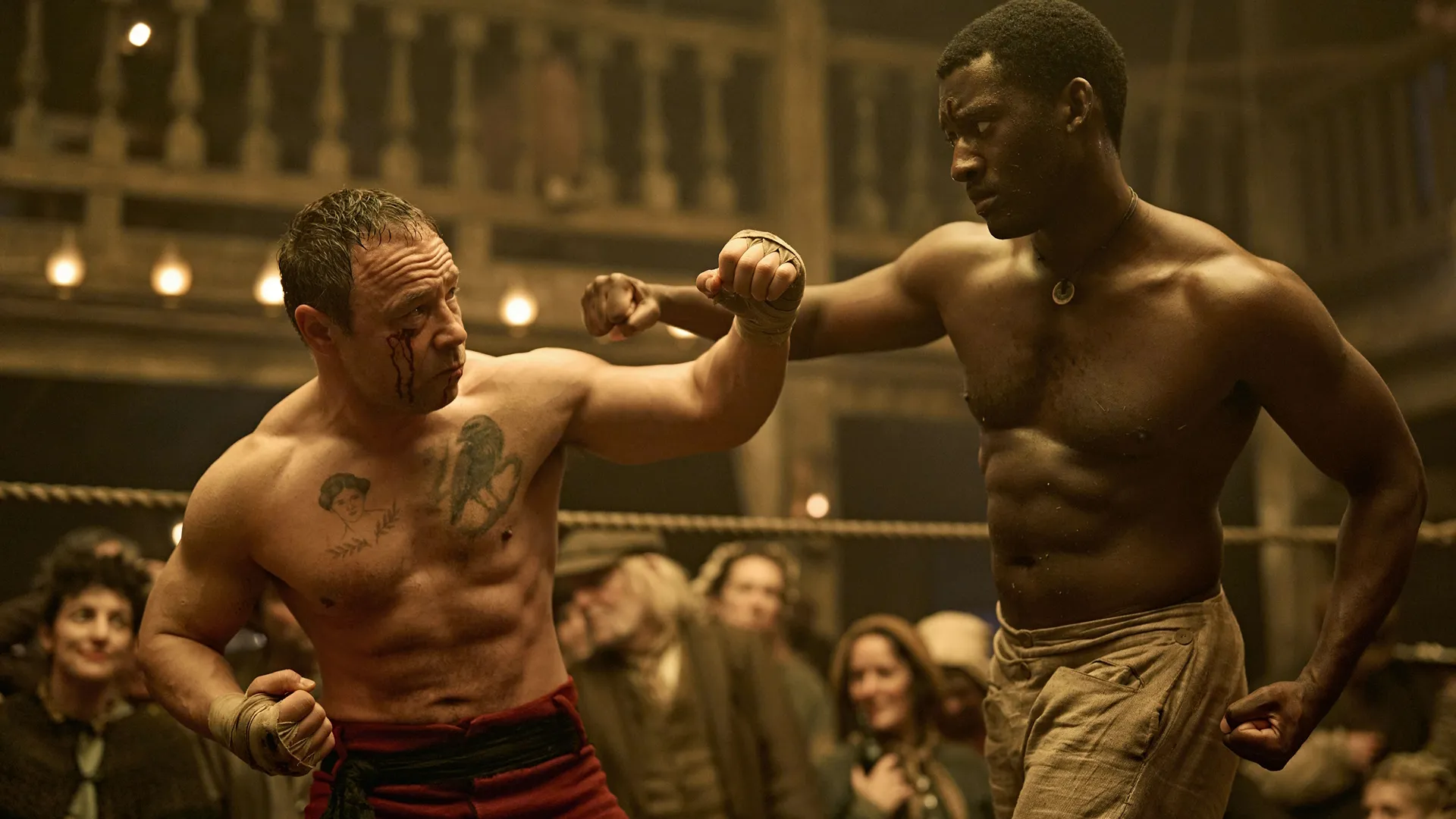 Sugar Goodson (Stephen Graham) blocks a punch from Hezekiah Moscow (Malachi Kirby) in the boxing ring.