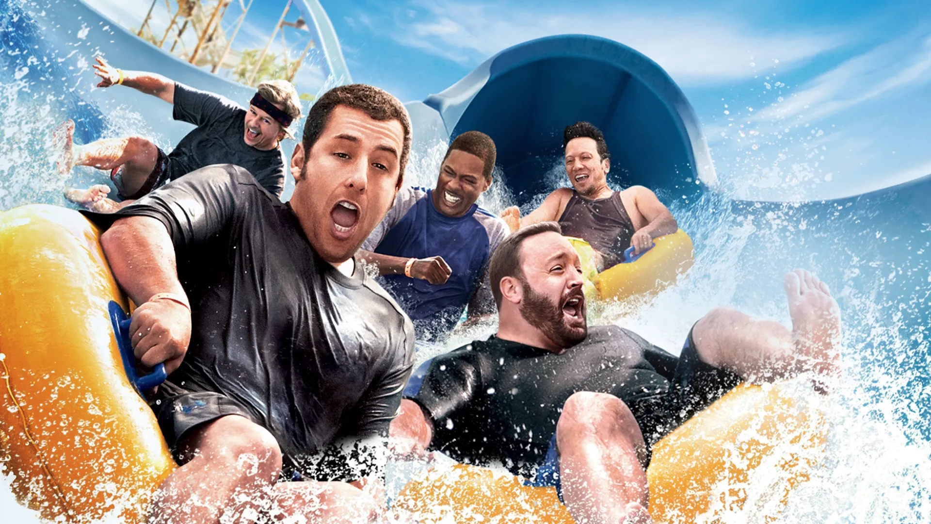This image is the promotional poster for the 2013 comedy sequel Grown Ups 2, starring Adam Sandler and a cast of comedic actors.