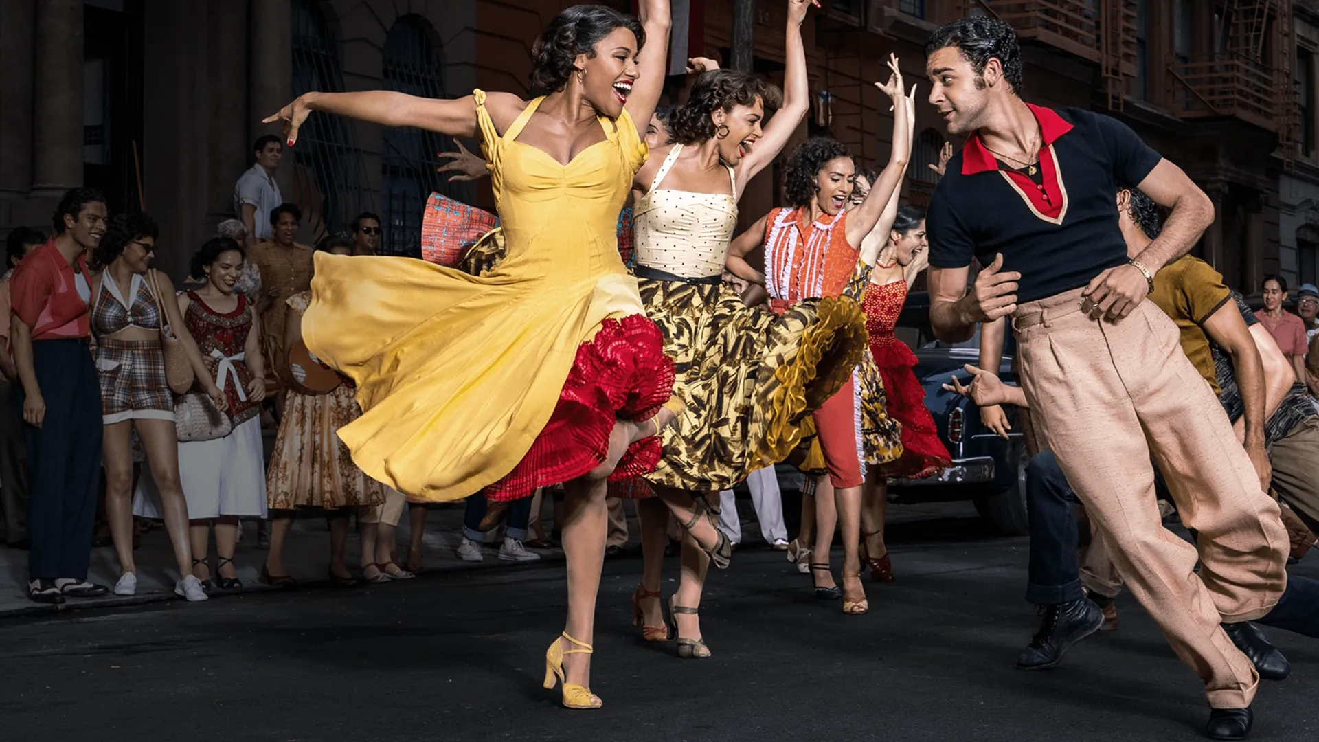 West Side Story characters dancing together in the street.