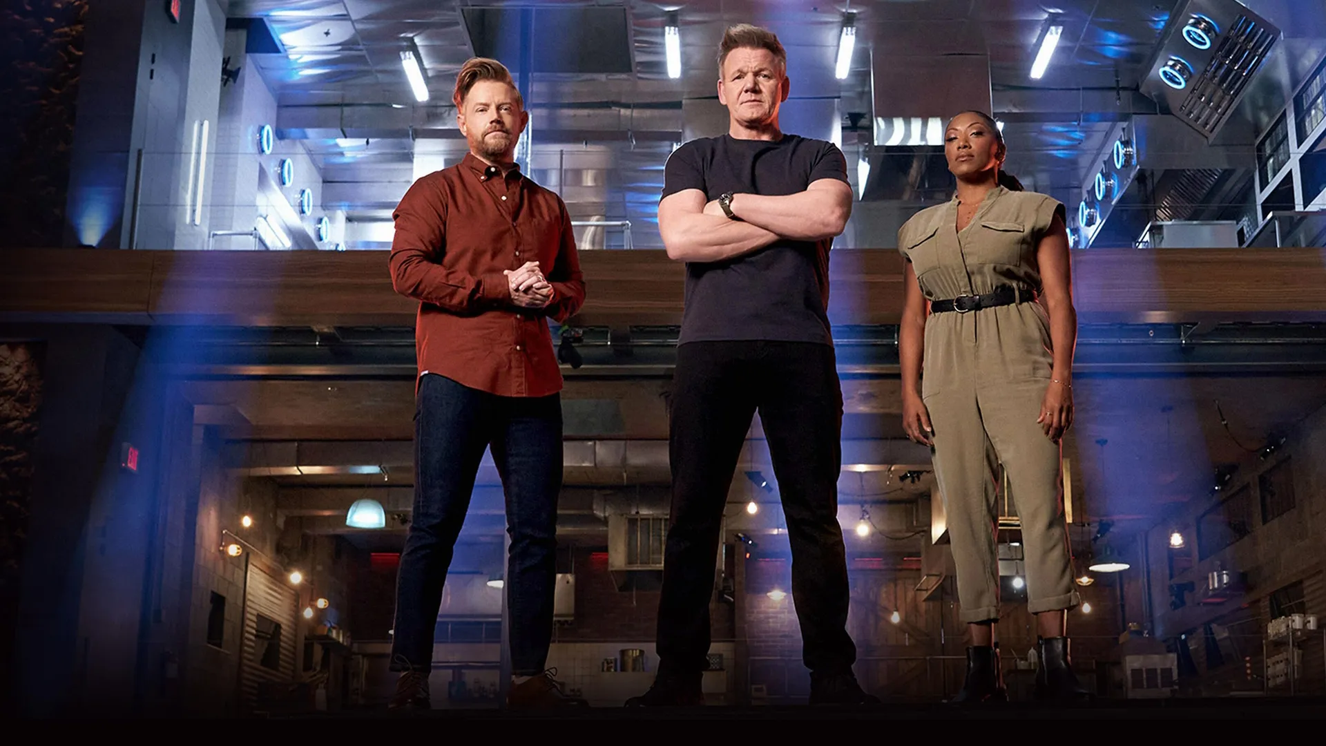 Judges Gordon Ramsay, Nyesha Arrington and Richard Blais stand in front of a kitchen in Next Level Chef