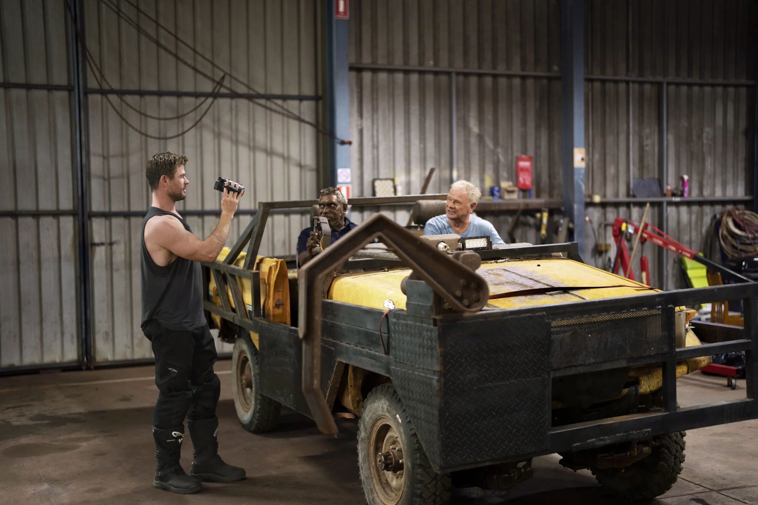 Chris and his father Craig meet with a friend, Spencer, in Bulman on their first visit back in 35 years. (Credit: National Geographic/Craig Parry)