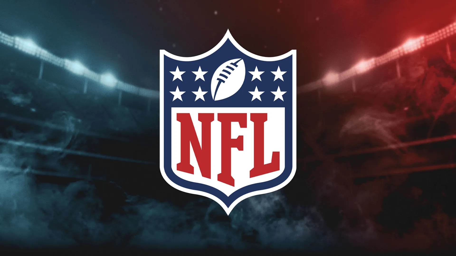 The official NFL shield logo is centered against a dark, dramatic stadium backdrop with misty smoke and lights split in blue and red.