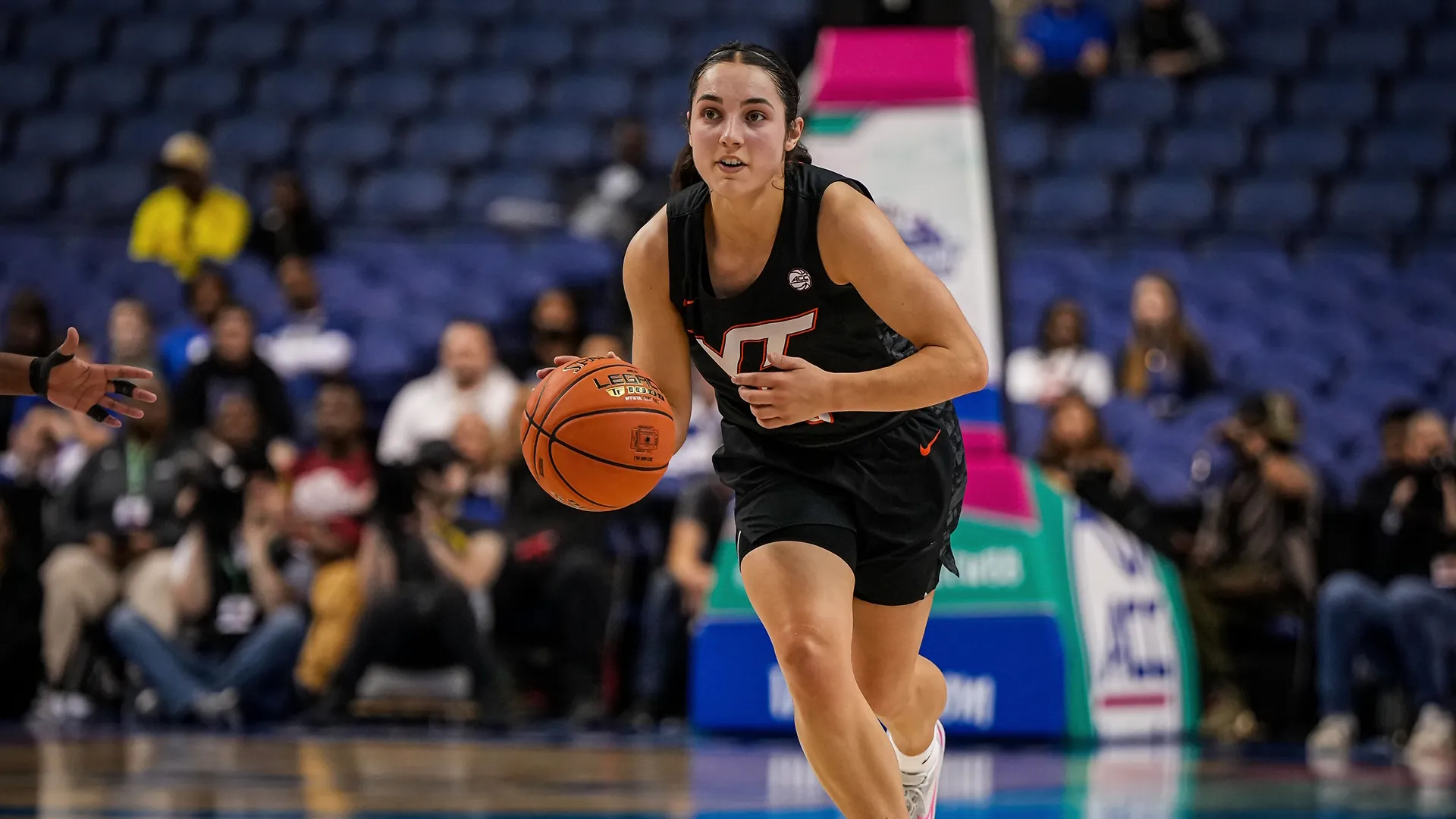 Virgina Tech player Georgia Amoore advances with the ball.