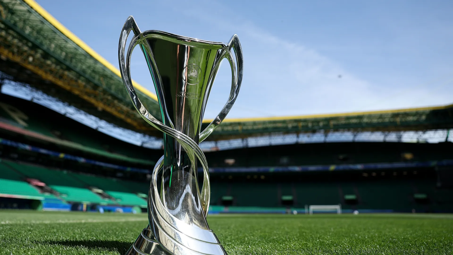 UEFA Women's Champions League trophy displayed in a football stadium.