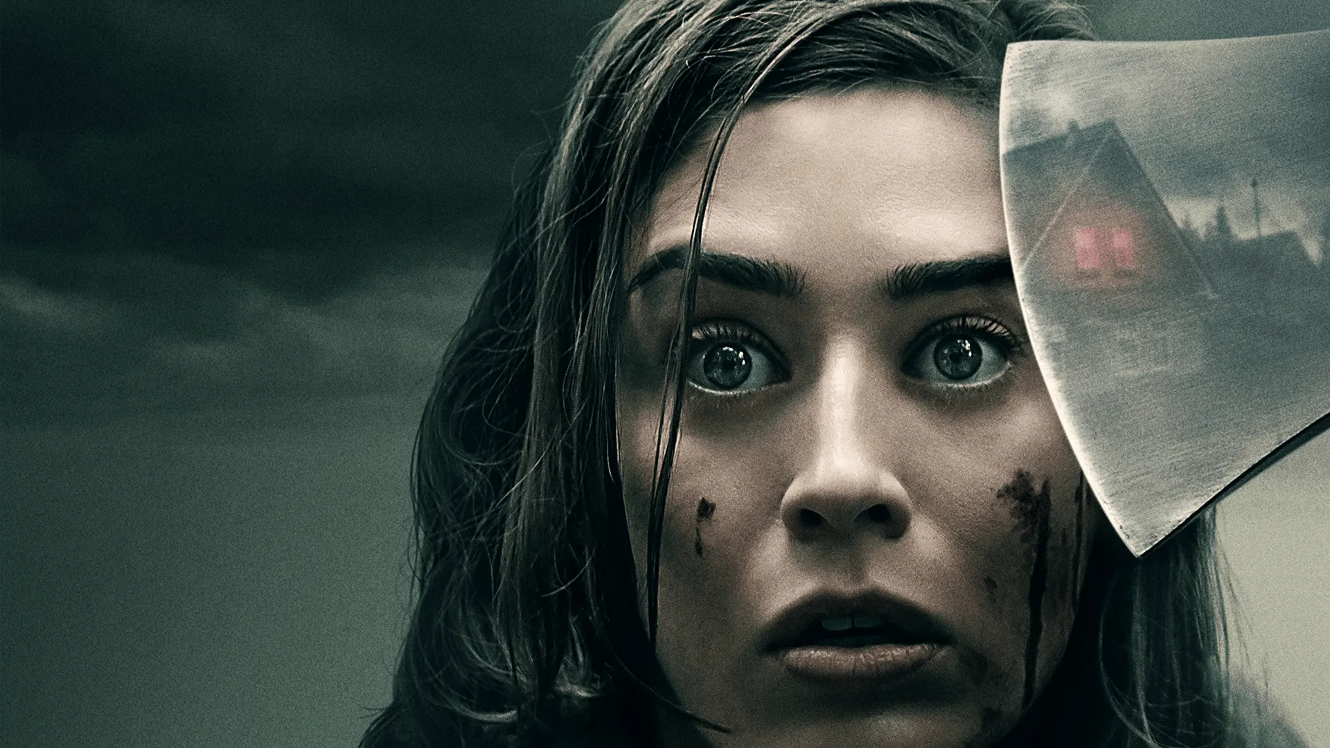 Lizzy Caplan as a young Annie Wilkes holding an axe in a promotional poster for the second season of the psychological horror series Castle Rock.