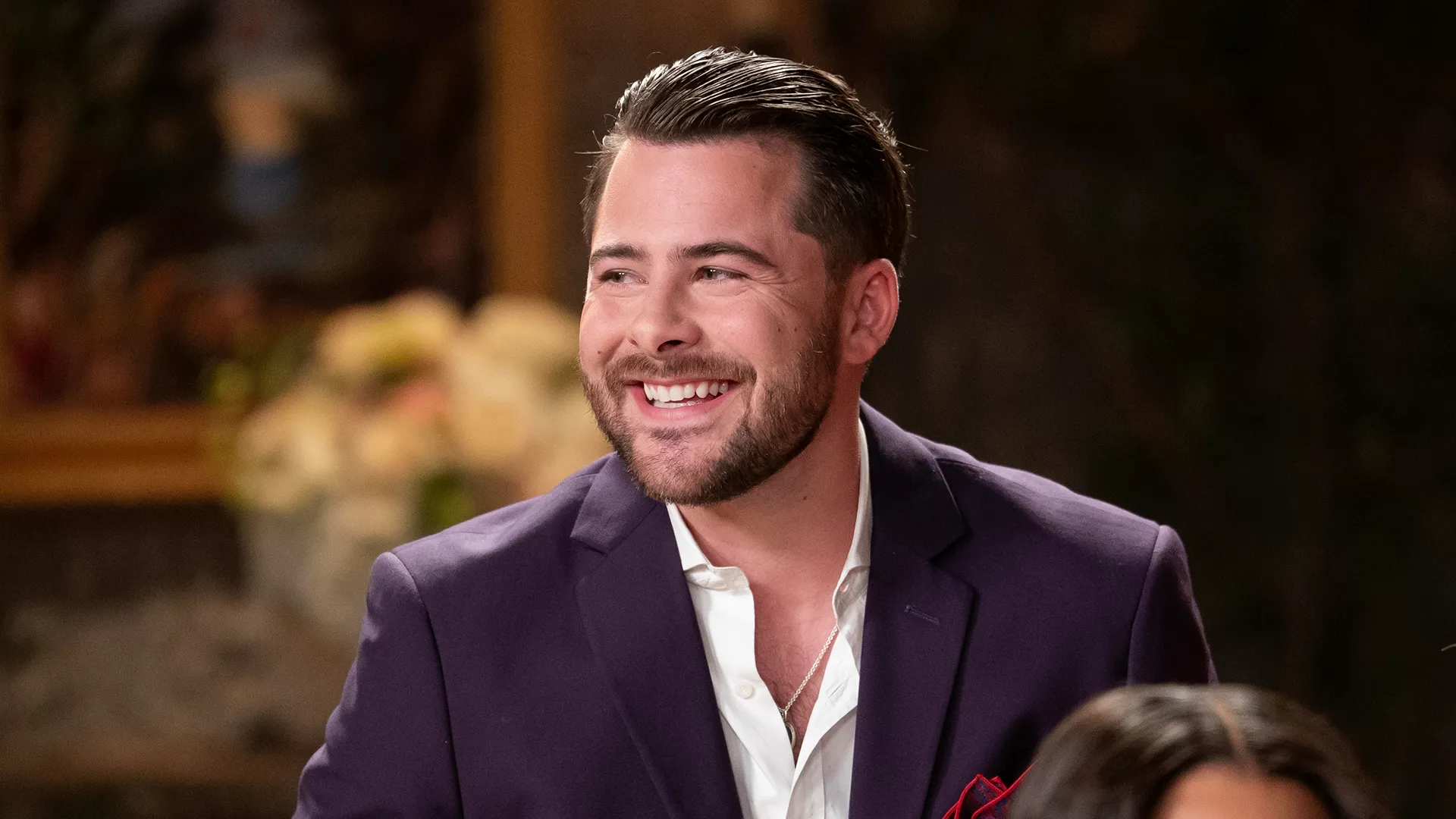 A closeup of Dominic smiling