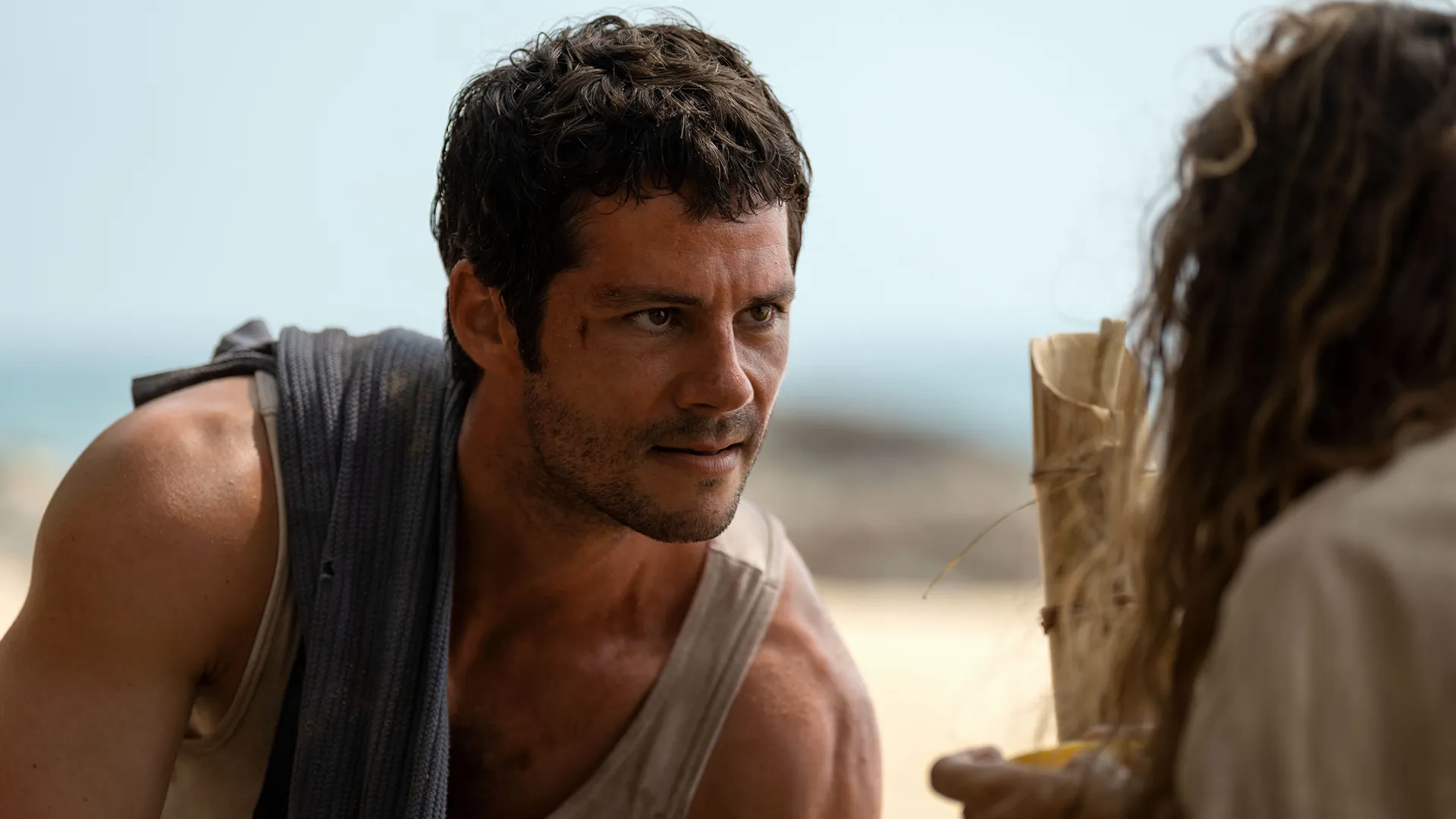 Dylan O'Brien starring in a scene of Send Help. O'Brien plays Bradley Preston, a boss who is stranded on a deserted island with his employee Linda Liddle.