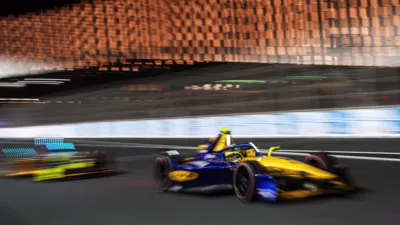 Formula E race car in action on a circuit, streaming with ESPN on Disney+.