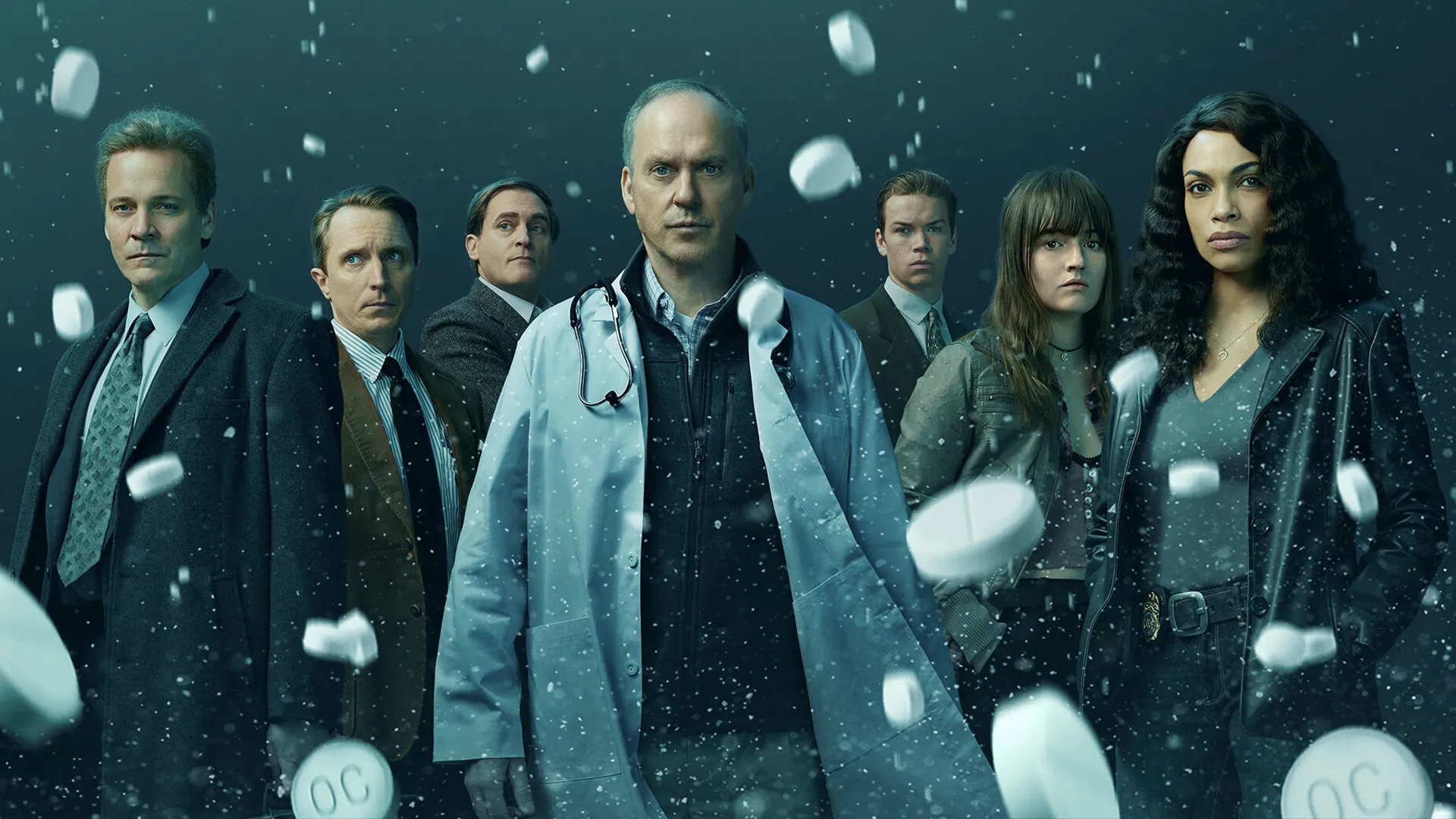 The cast of Dopesick ona poster for the show, with white pills falling around them