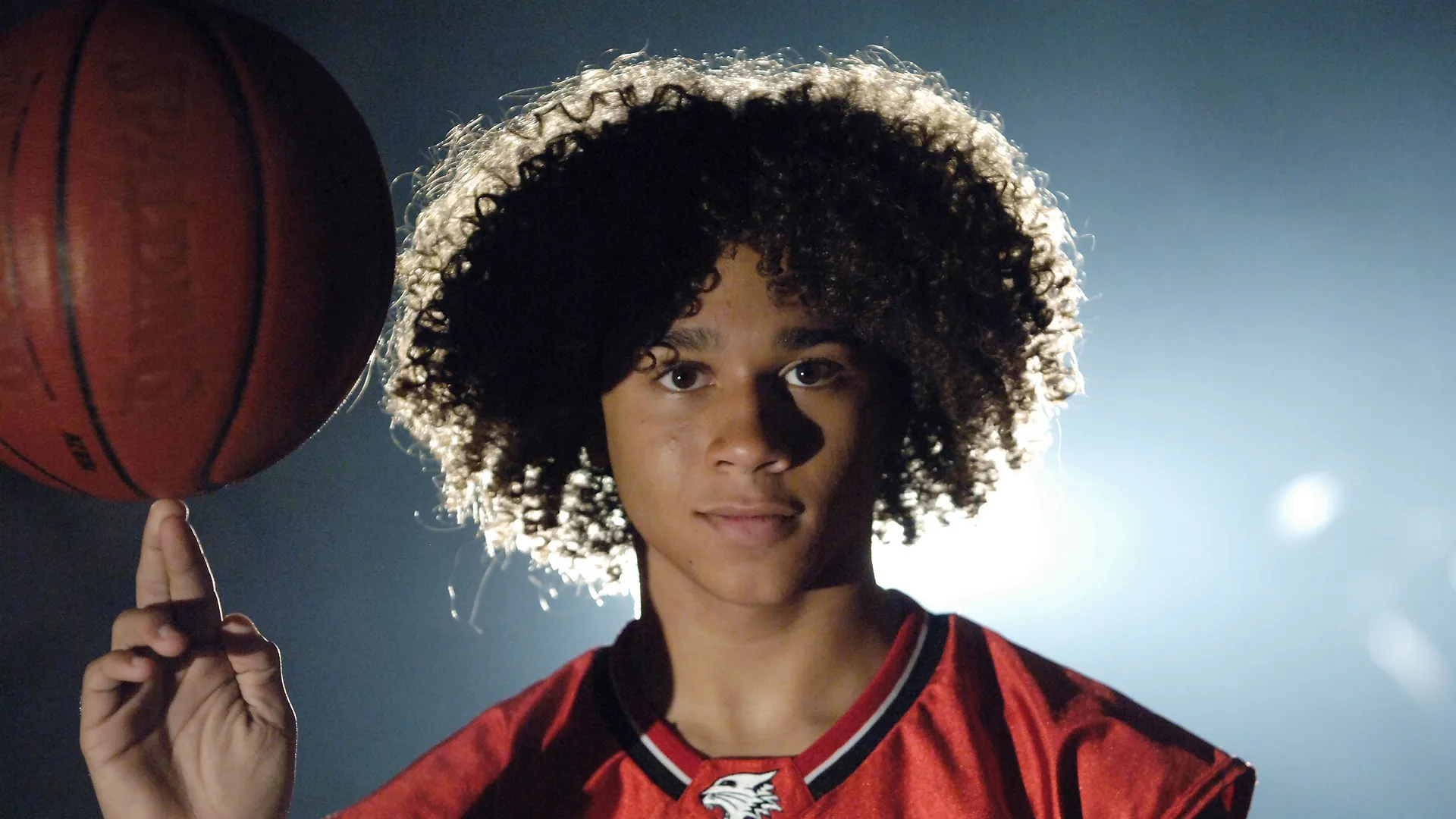 A closeup of Chad (Corbin Bleu) spinning a basketball on his fingers in High School Musical