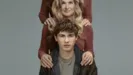 Key Art for Phony. Sonny (Sam Nivola) sits in the foreground with Ellen's (Connie Britton) hands on his shoulders. On Ellen's shoulders are the hands of someone whose face we can't see, wearing the same clothes as Ellen