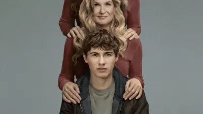 Key Art for Phony. Sonny (Sam Nivola) sits in the foreground with Ellen's (Connie Britton) hands on his shoulders. On Ellen's shoulders are the hands of someone whose face we can't see, wearing the same clothes as Ellen