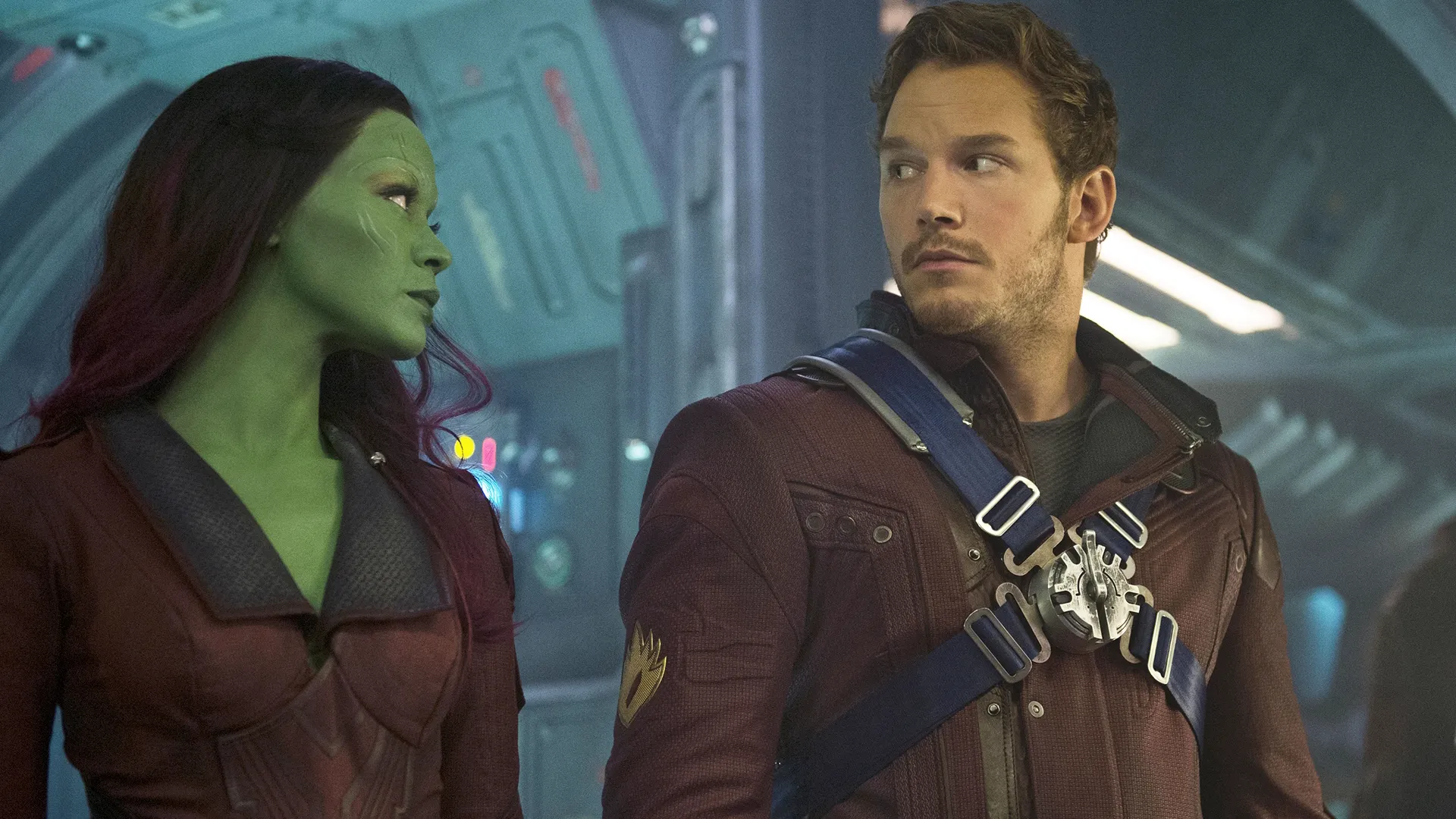 Gamora (Zoe Saldana) looking at Peter Quill (Chris Pratt) in Guardians of the Galaxy.
