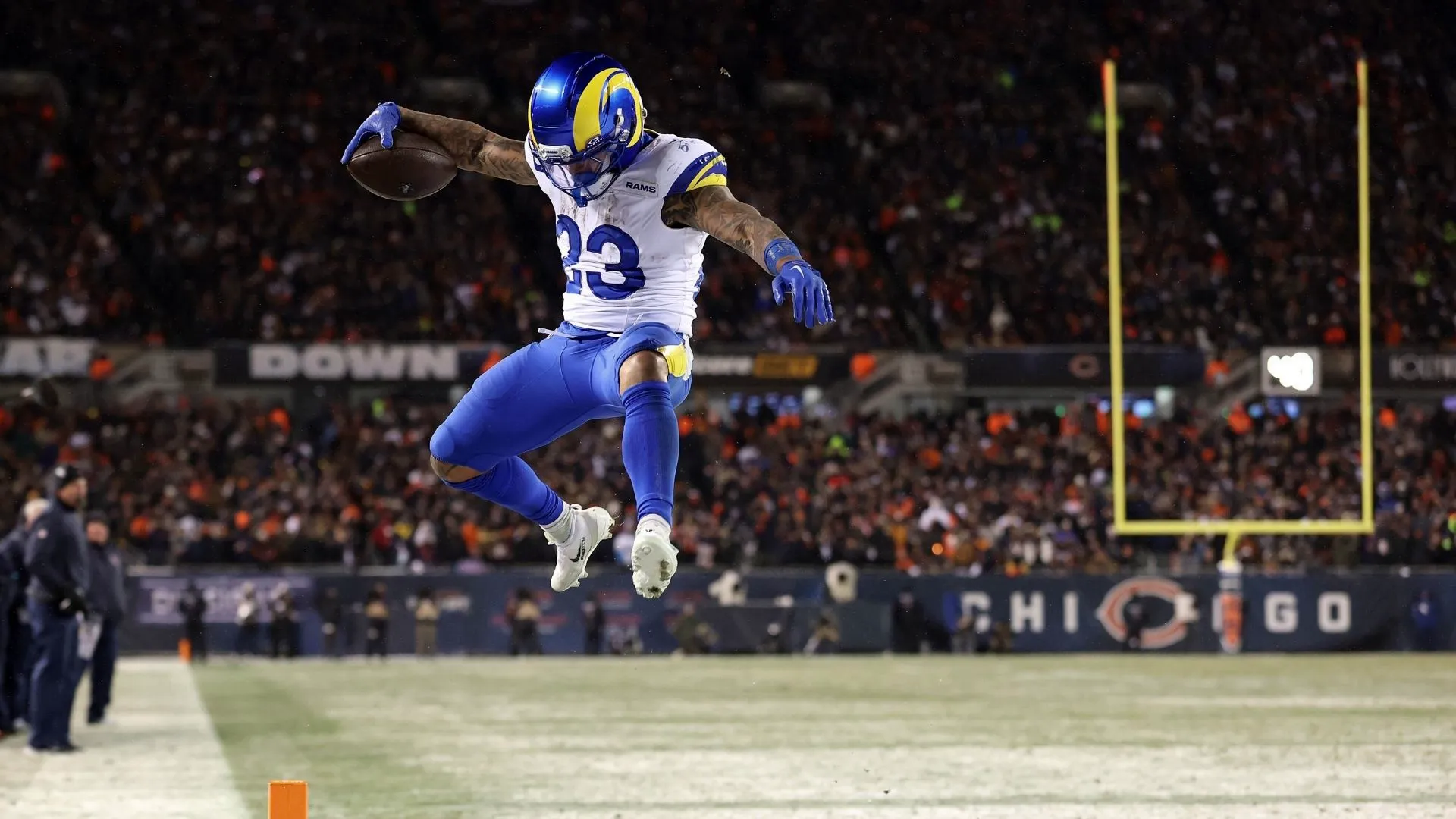Kyren Williams #23 of the Los Angeles Rams scores a rushing touchdown against the Chicago Bears during the fourth quarter in the NFC Divisional Playoffs at Soldier Field on January 18, 2026 in Chicago, Illinois.